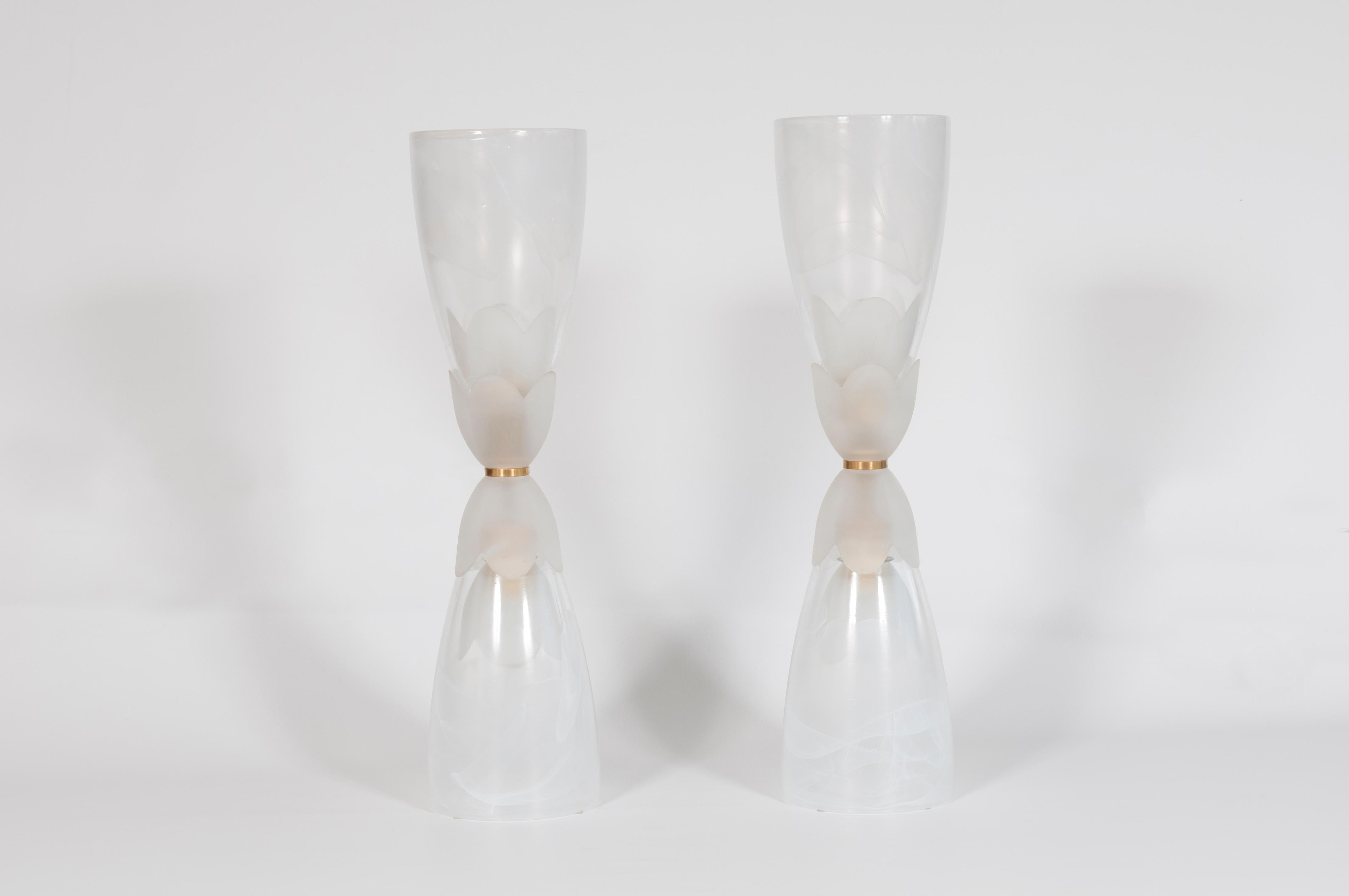 Beautiful Italian Venetian pair of table lamps, blown Murano glass white nuanced, 1980s
They are made up of a fantastic two opaque glass cups in the middle with a shape as a flower form; two glass cups at the extremity low and high in white