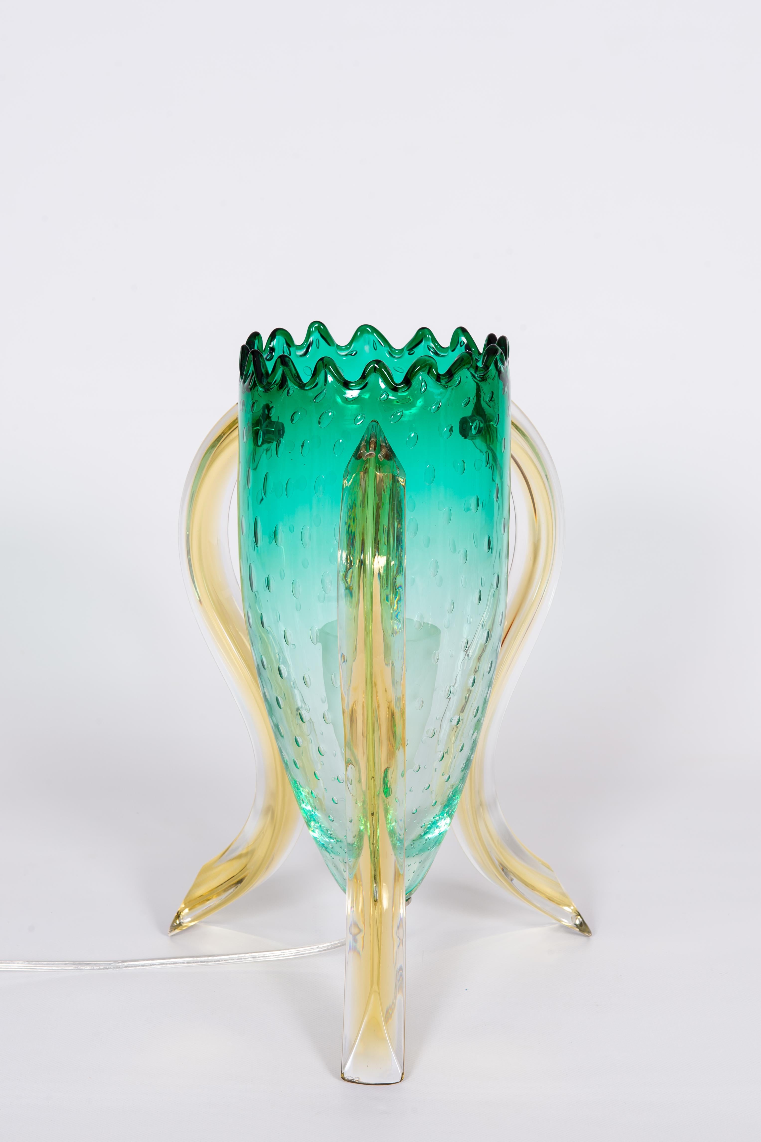 Astonished and unique limited edition, Italian Pair of Table Lamps in Blown Murano Glass Green and Amber, 1990s. Limited Edition.
This astonished pair of table lamp, is a unique design, by our Gallery, Vintage Murano Gallery. They are made up of a