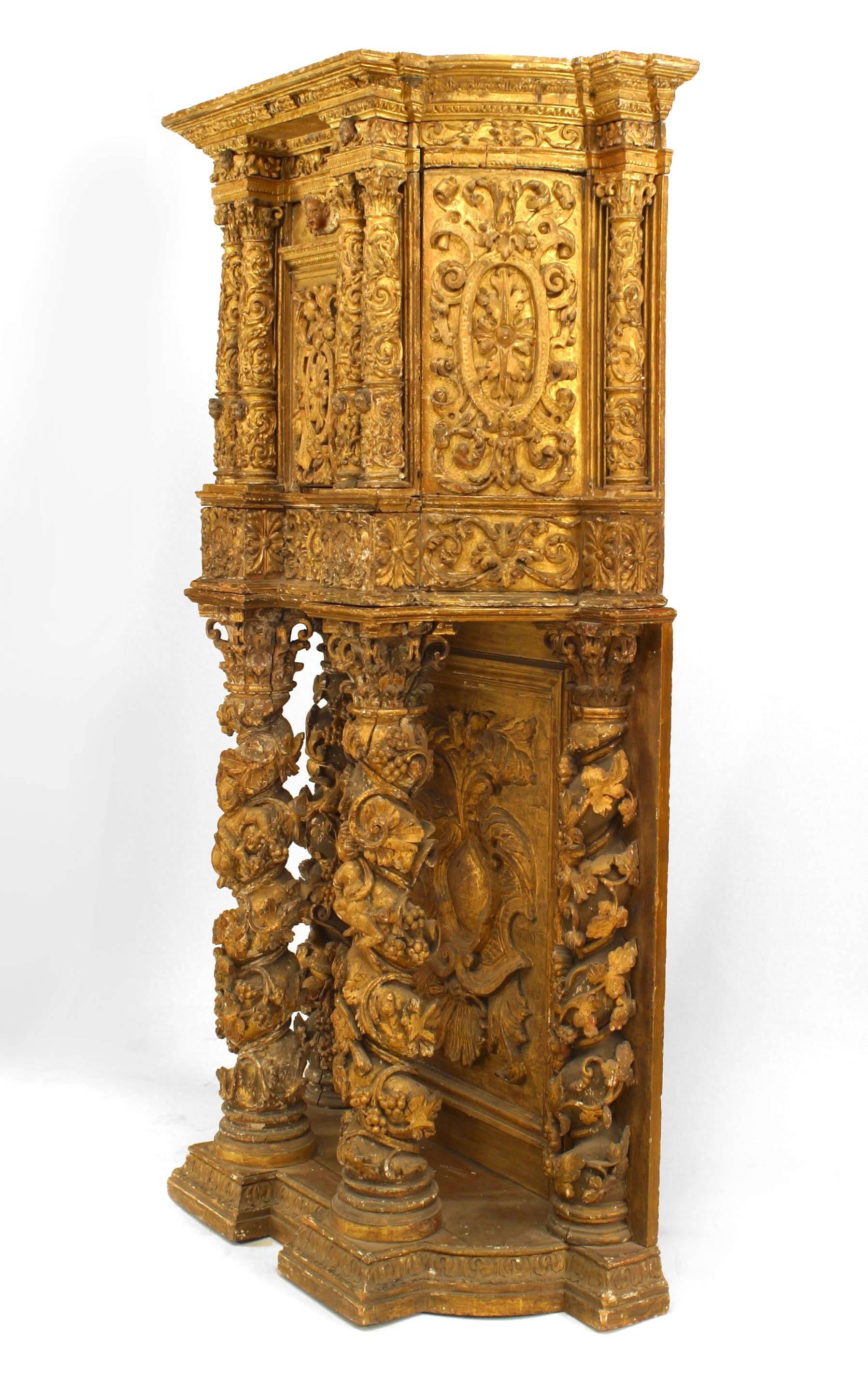 Italian Venetian (17th Century) carved and gilt cabinet with columns on base and cupid heads with 1 door.
