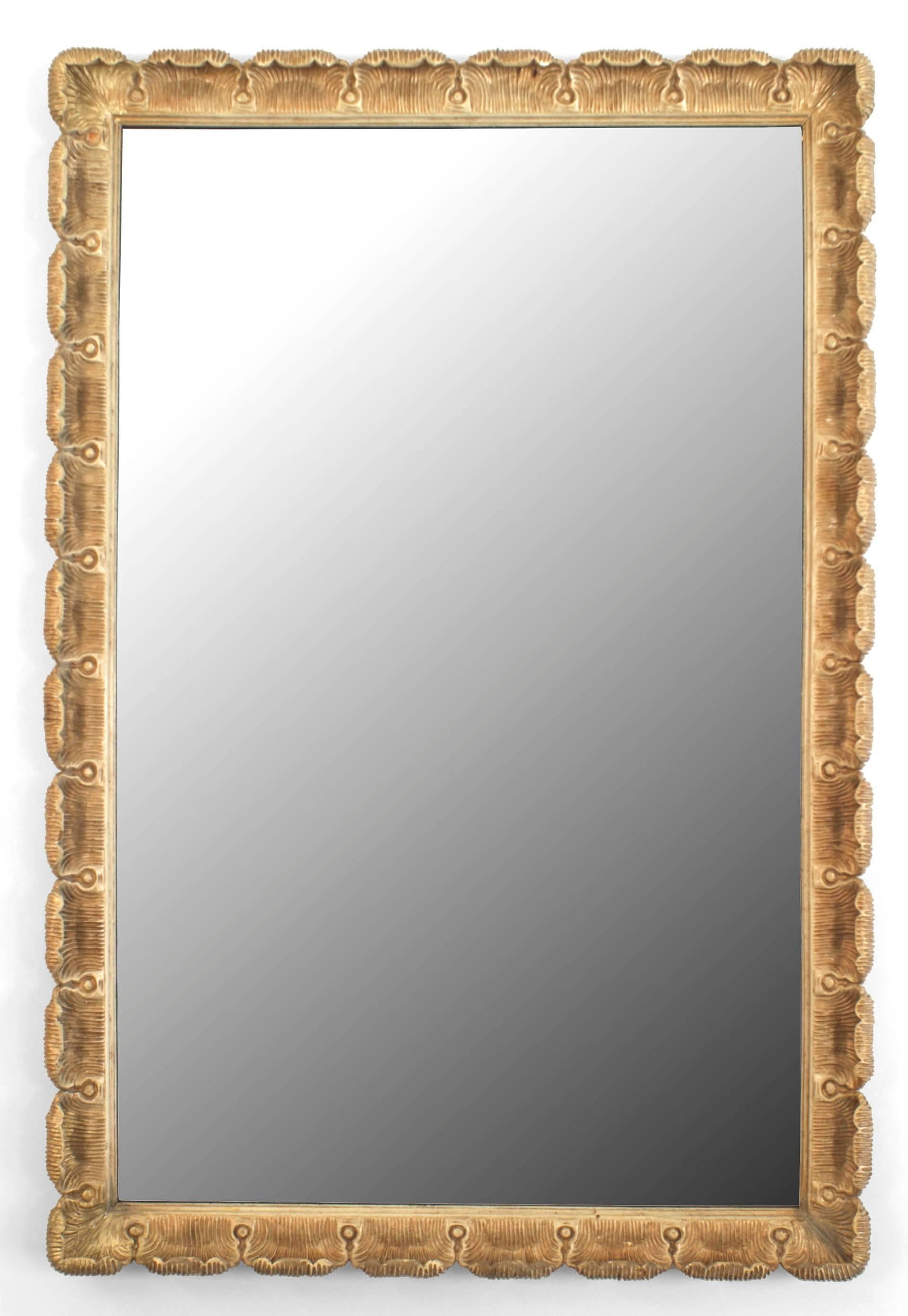 Italian Venetian style, (1950s) gilt and cream painted trimmed carved fluted and scalloped frame wall mirror.
 