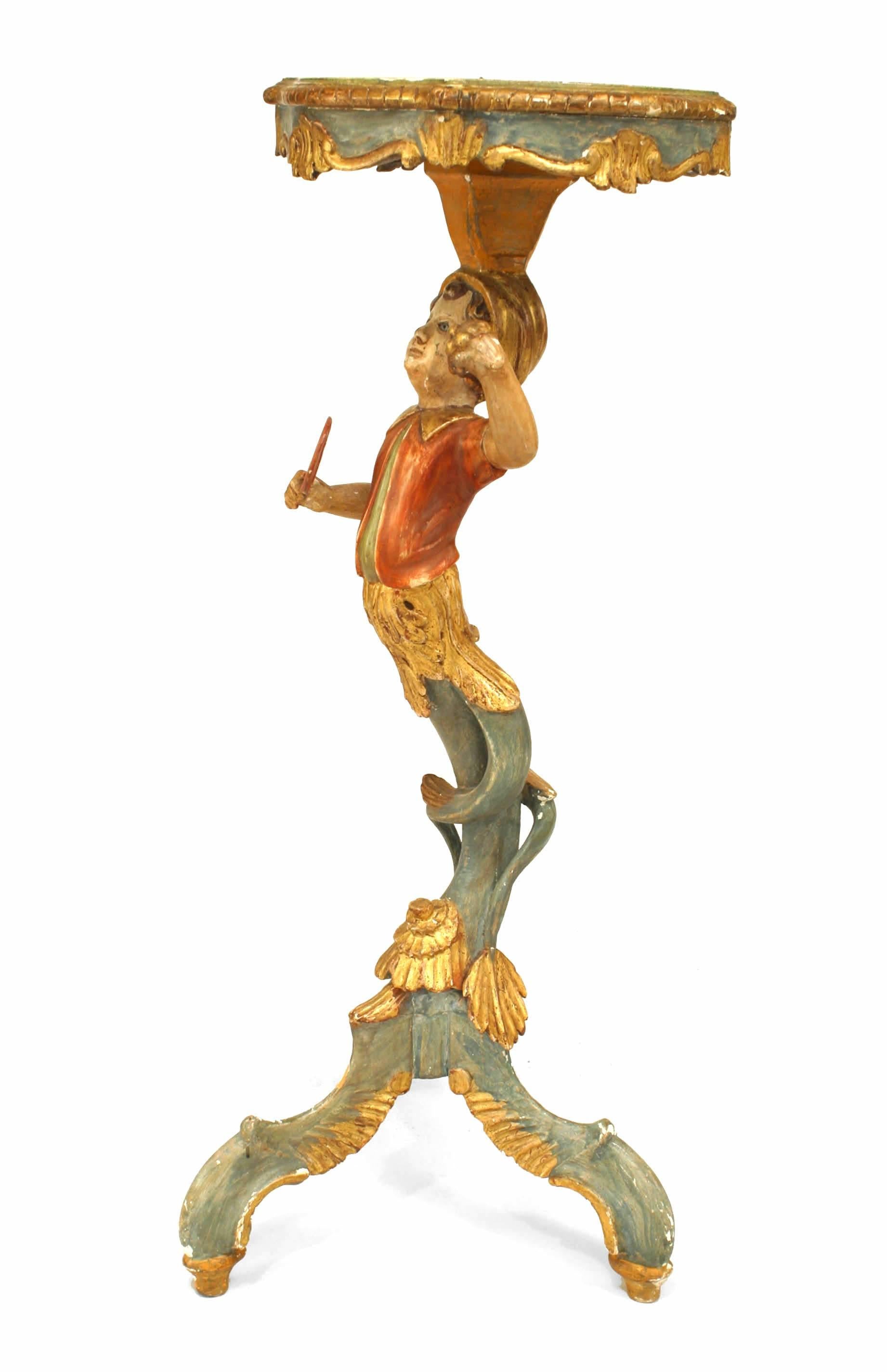 Italian Venetian style (19/20th Cent) polychromed pedestal stand with a figure of a young boy holding a fan and grapes.
