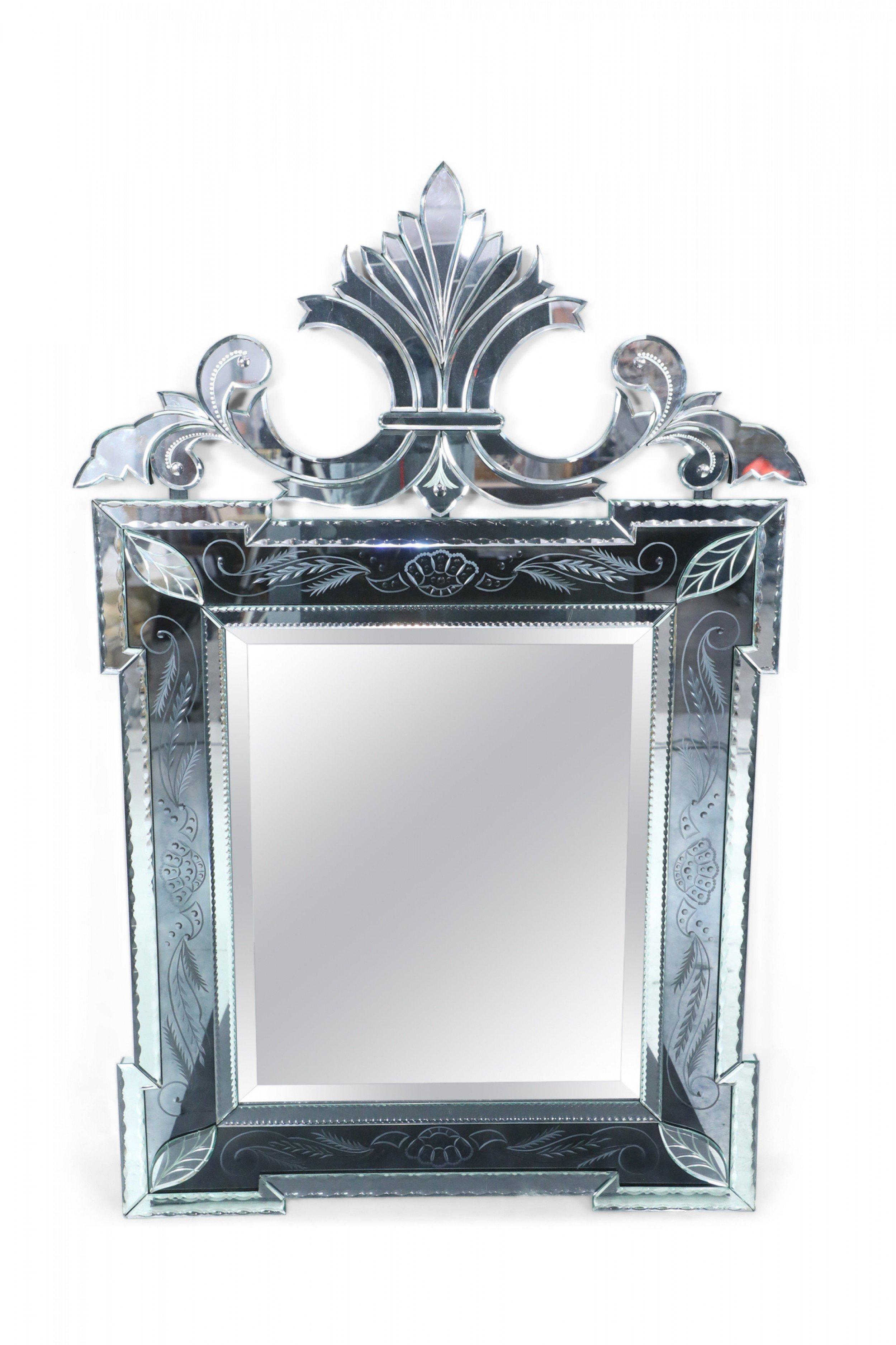 Italian Venetian-style (20th century) wall mirror with etched floral design panels and a double sided scroll pediment top.