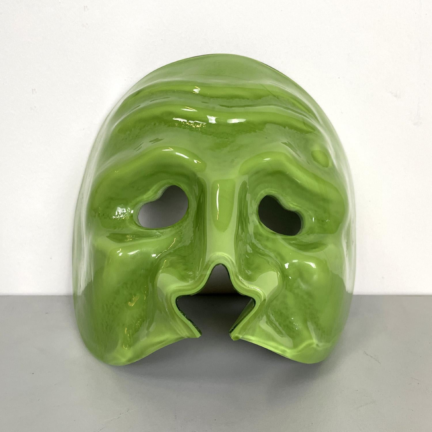 Italian Venetian style mask sculpture in green Murano glass by Venini, 1990s
Green Murano glass sculpture. It represents a Venetian-inspired mask, with facial details and a cut nose.
Produced by Venini in 1990s. Label present.
Very good
