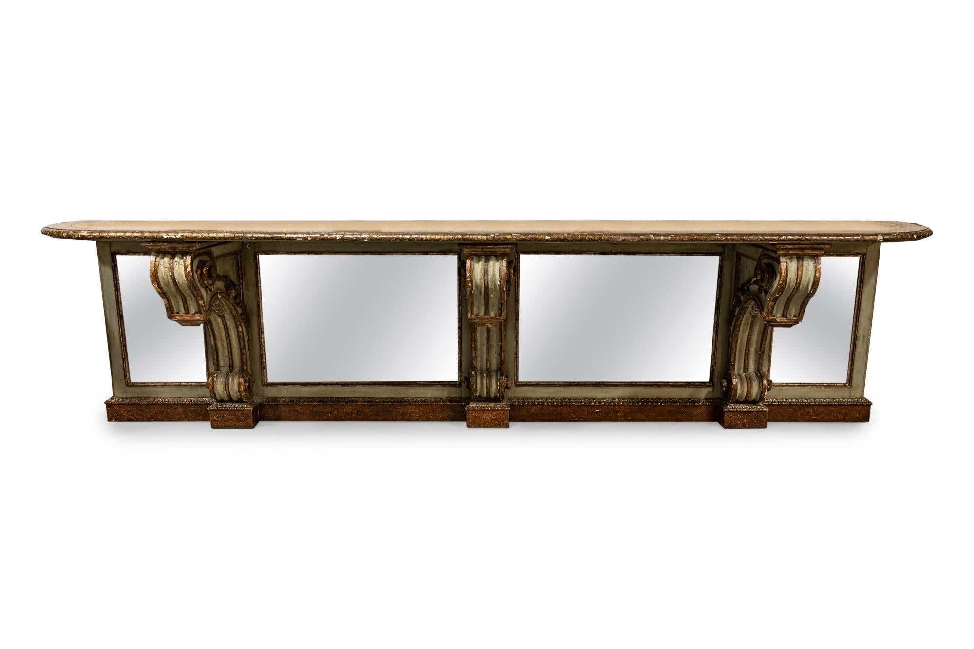 Italian Rococo-style (18th Century possibly Venetian) monumental console table with 4 mirrored panels separated by 3 large carved scrolls having a gilt, green, and off-white painted finish.