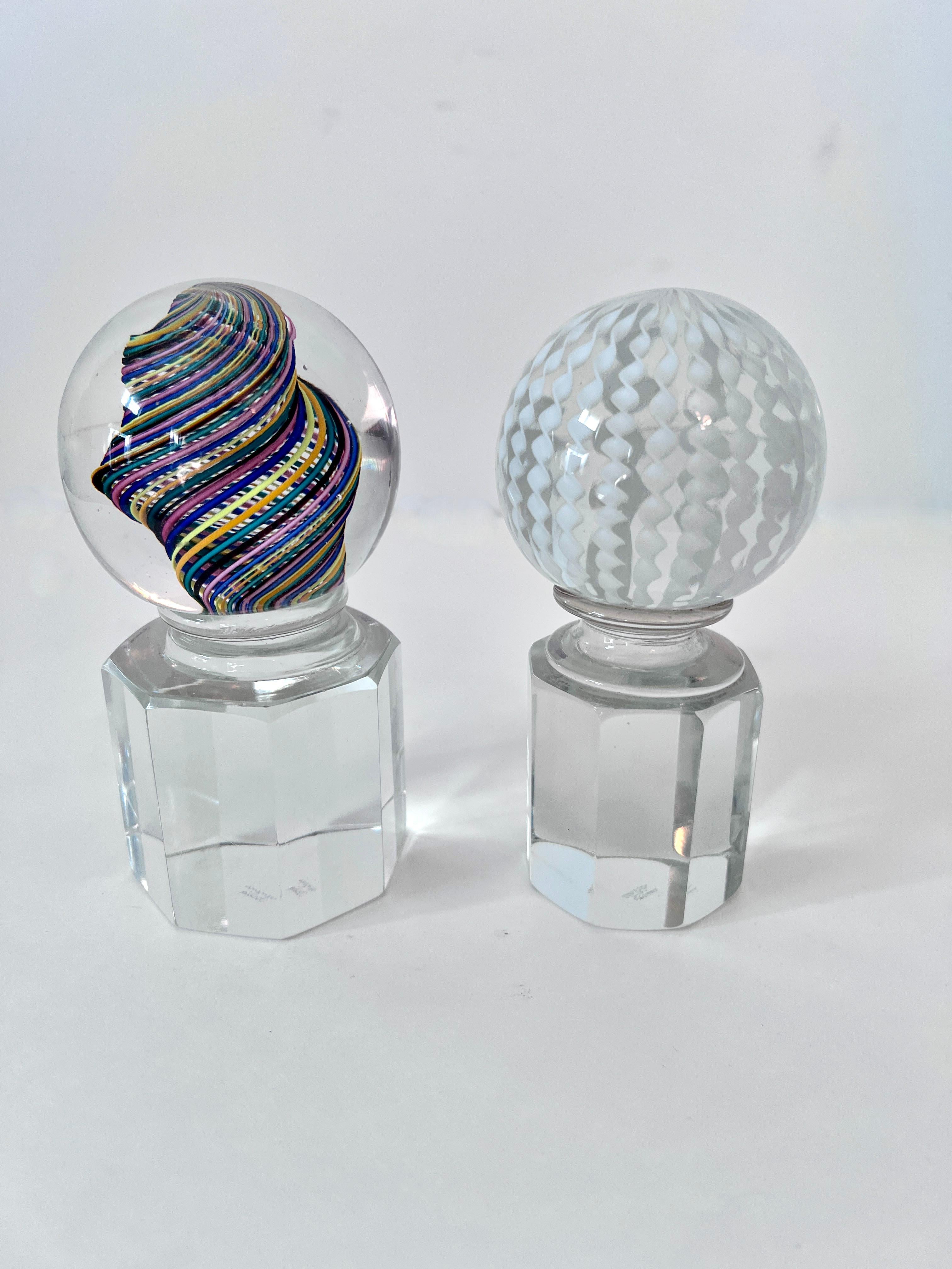 Murano Paperweight by Venini Italy.  This pieces are sold individually or as a pair and are a stunning compliment to any desk or work station.   Hand Crafted with multi colored Ribbons and white ribbons, and of a good weight.  They work well as