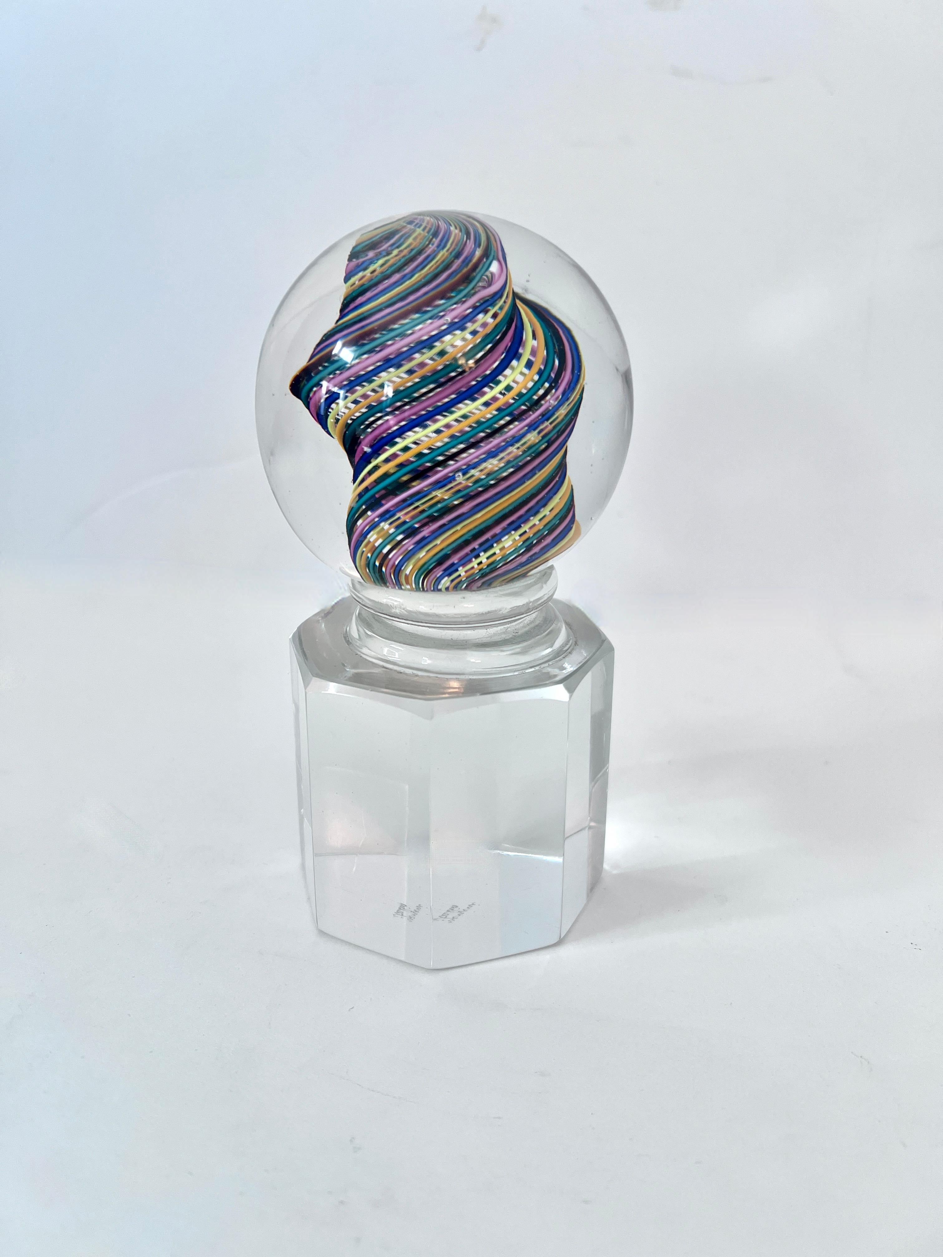 Murano Paperweight by Venini Italy.  This piece is a stunning compliment to any desk or work station.   Hand Crafted with multi colored Ribbons and of a good weight.  Could actually serve as a bookend as well!  we have a pair, the remaining one is a