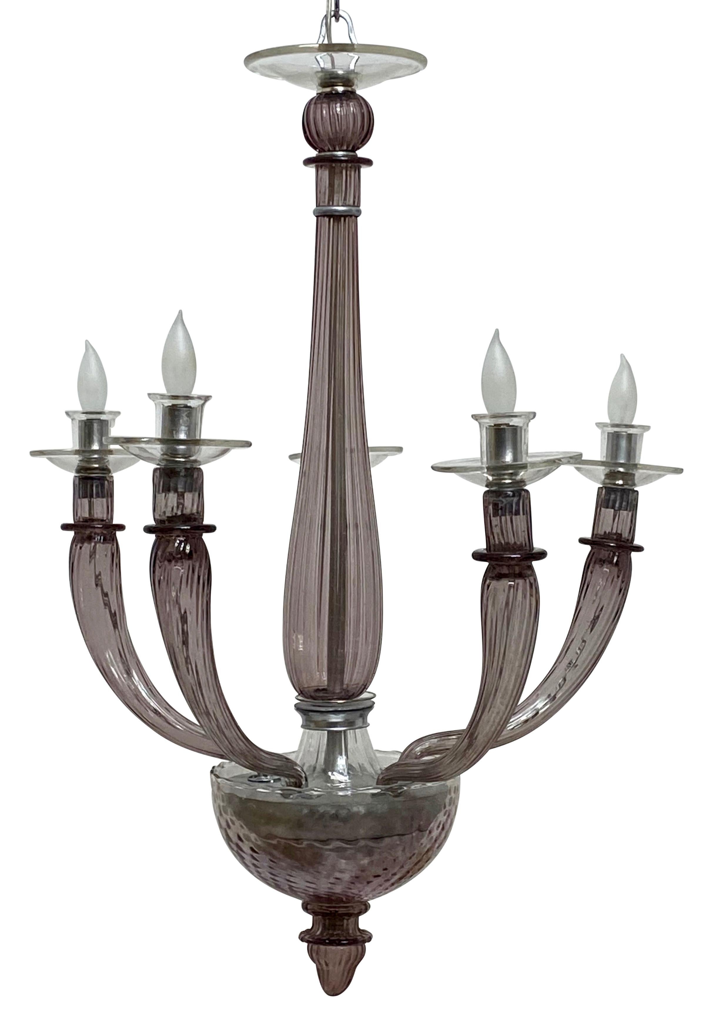 Beautiful amethyst color art glass light fixture, most likely made by Venini,
Italy, mid-20th century.
Impressive and large scale in size.
Fully re-stored and re-wired.
Holds chandelier size light bulbs.
The chain measures 28