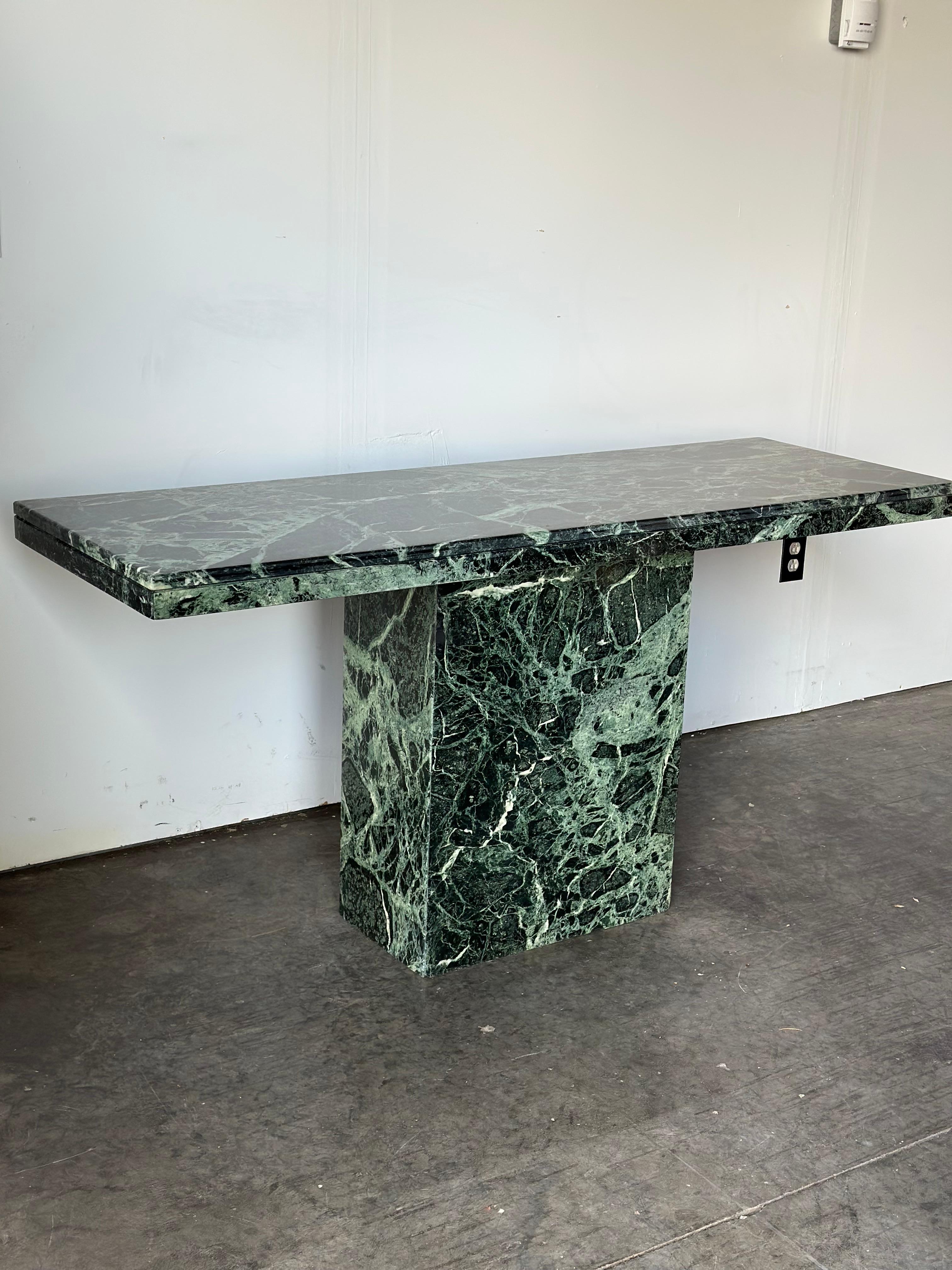 Italian verde marble sofa table. Top detaches from base for easy transport. Excellent vintage condition with no notable signs of wear. This table has a significant weight.