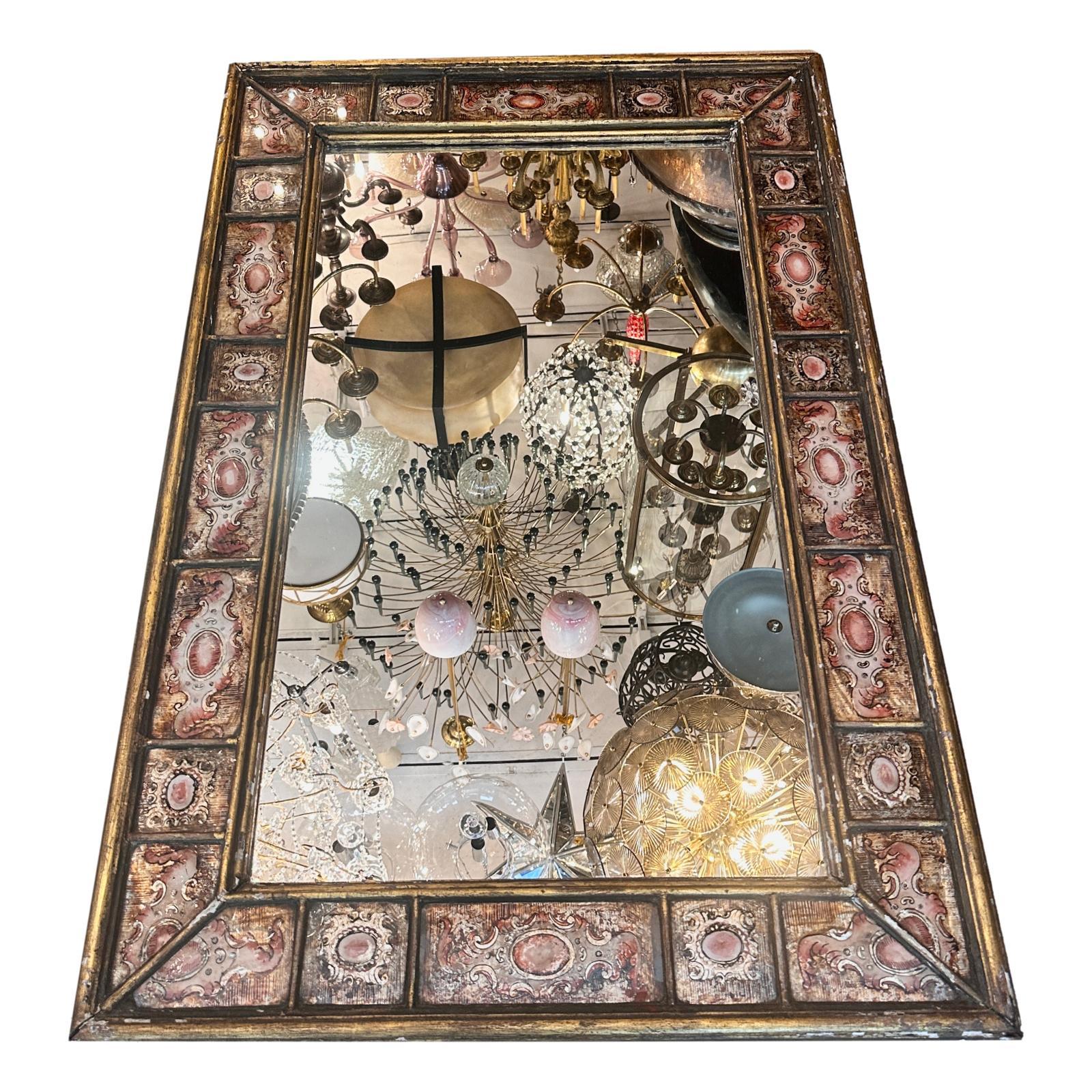 A circa 1940's Italian verre eglomise' mirror with original patina.

Measurements:
Height: 49.5