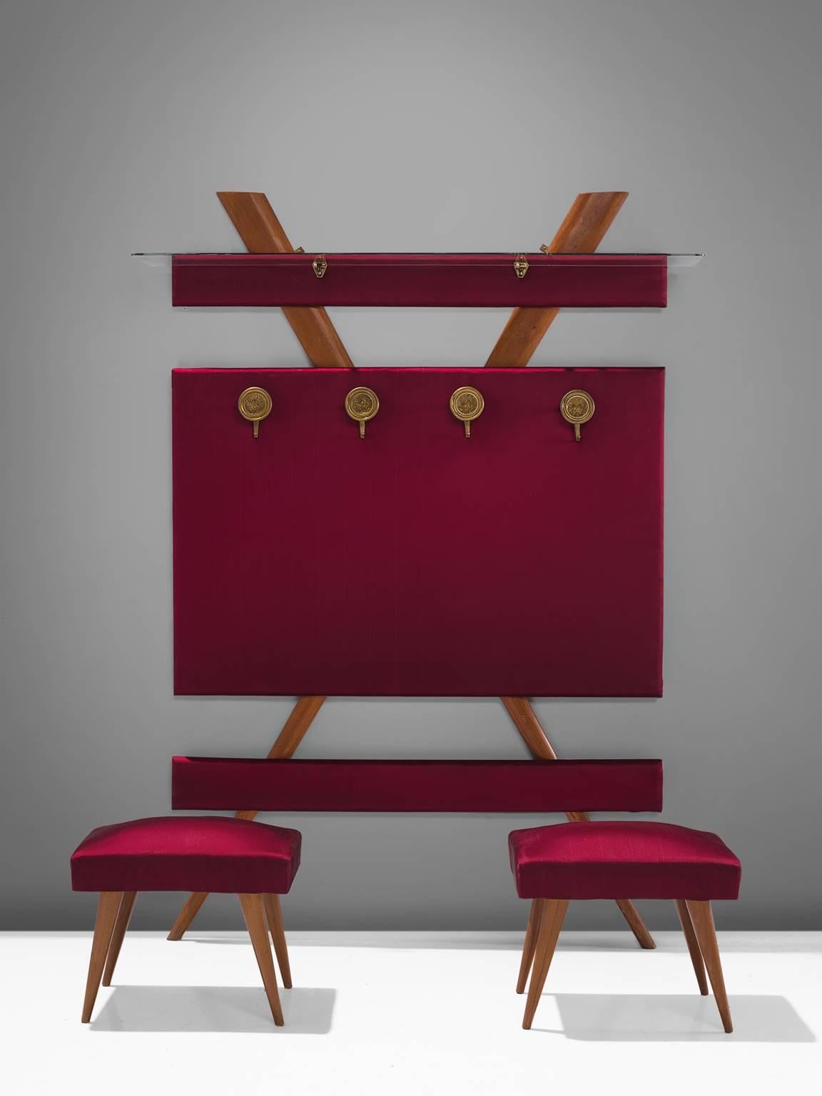 Vestibule set including stools and coat rack, wood and red fabric, Italy, 1950s

This elegant set is an ensemble of a coat rack, shelf a two stools. The set is executed in wood and features a playful, figurative aesthetic. The coat rack has a