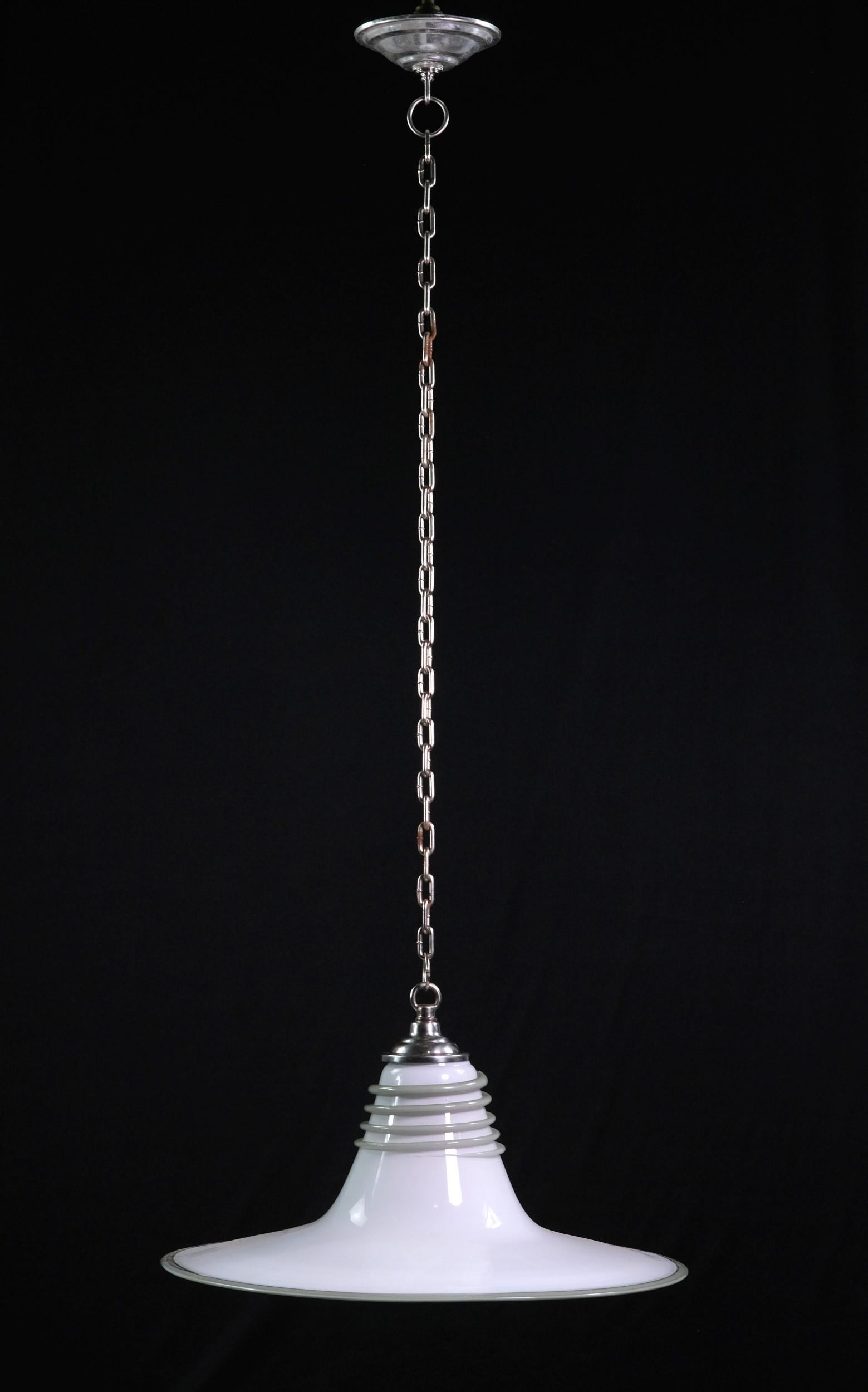 20th century, Vetri Murano hand blown glass pendant light hanging from a nickeled chain fitter and canopy. Adding to its unique design, there is a gray glass coil wrapped around the top of the white glass shade. Due to the coil glass being hand
