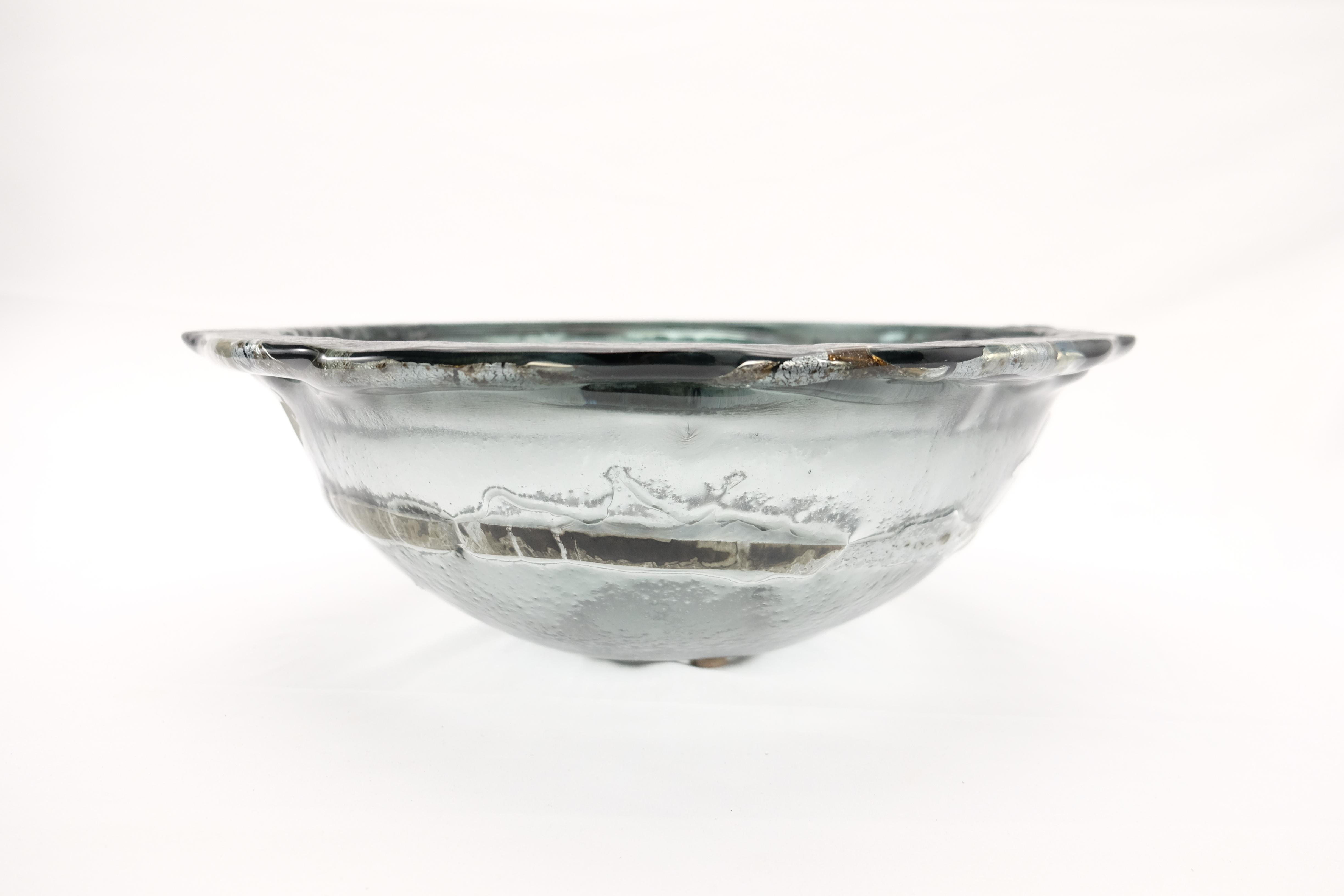 Offered for sale is an original one-of-a-kind art glass bowl from the Italian Vetrofuso di Daniela Poletti Studio. Vetrofuso directly draws on ancient techniques of glass fusion, melting them with modern creativity and a tireless spirit of research