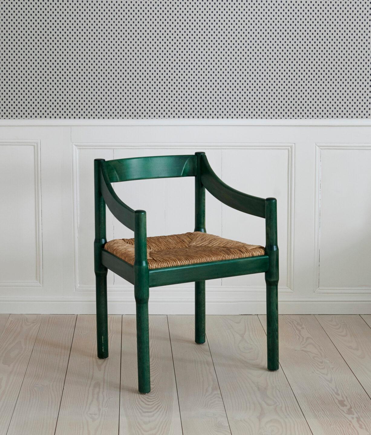 Vico Magistretti
Italy, 1959

Carimate armchair. Green painted wood, wicker seat.

Industrial designer and architect Vico Magistretti (1920-2006) graduated from the Faculty of Architecture at Politecnico di Milano in 1945.
The Carimate chair –
