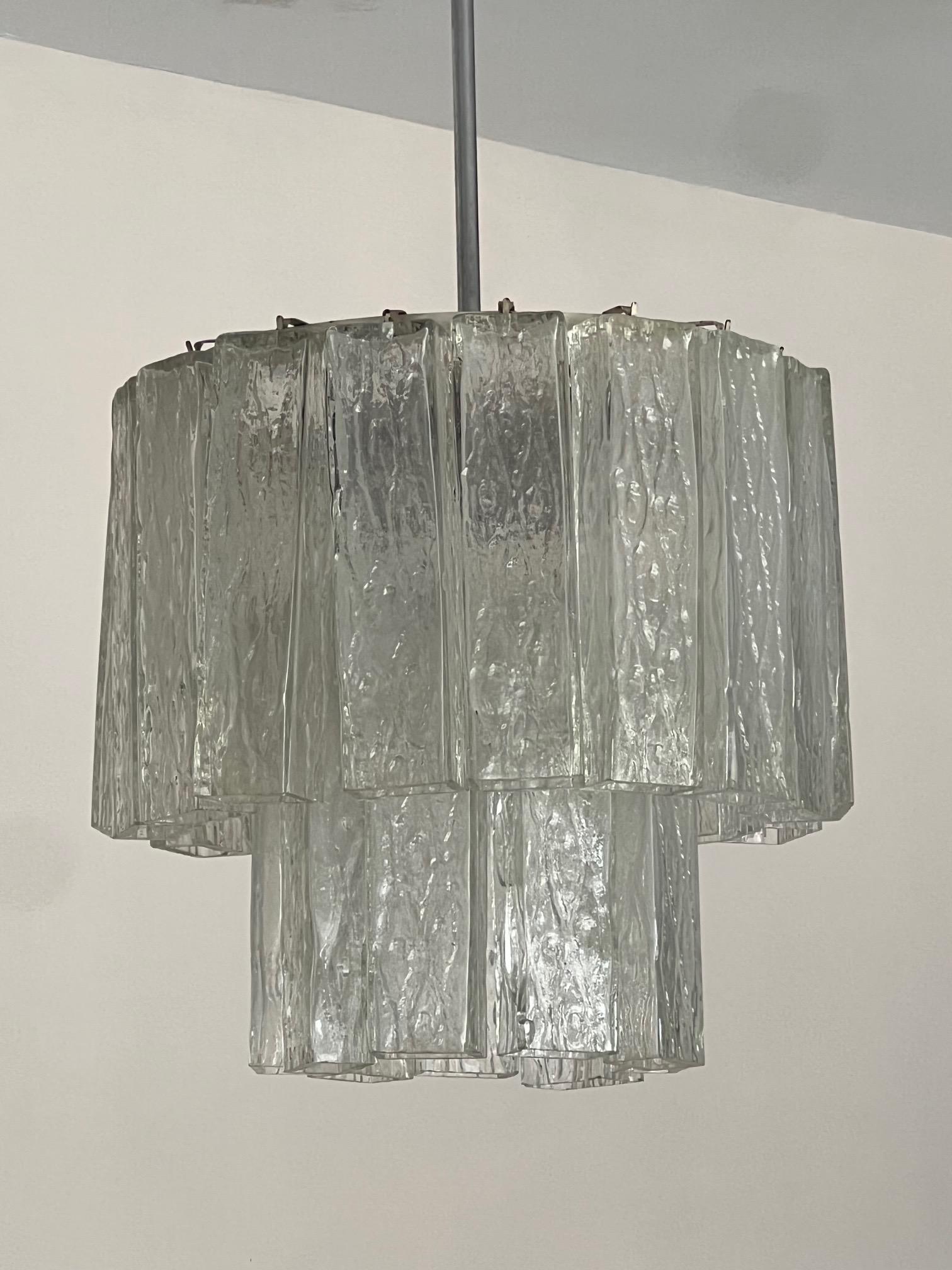 An elegant and simple Italian murano chandelier 'ca' 1970's. Chromed stem and canopy with beautiful Murano glass shades.Glass measures approx 16