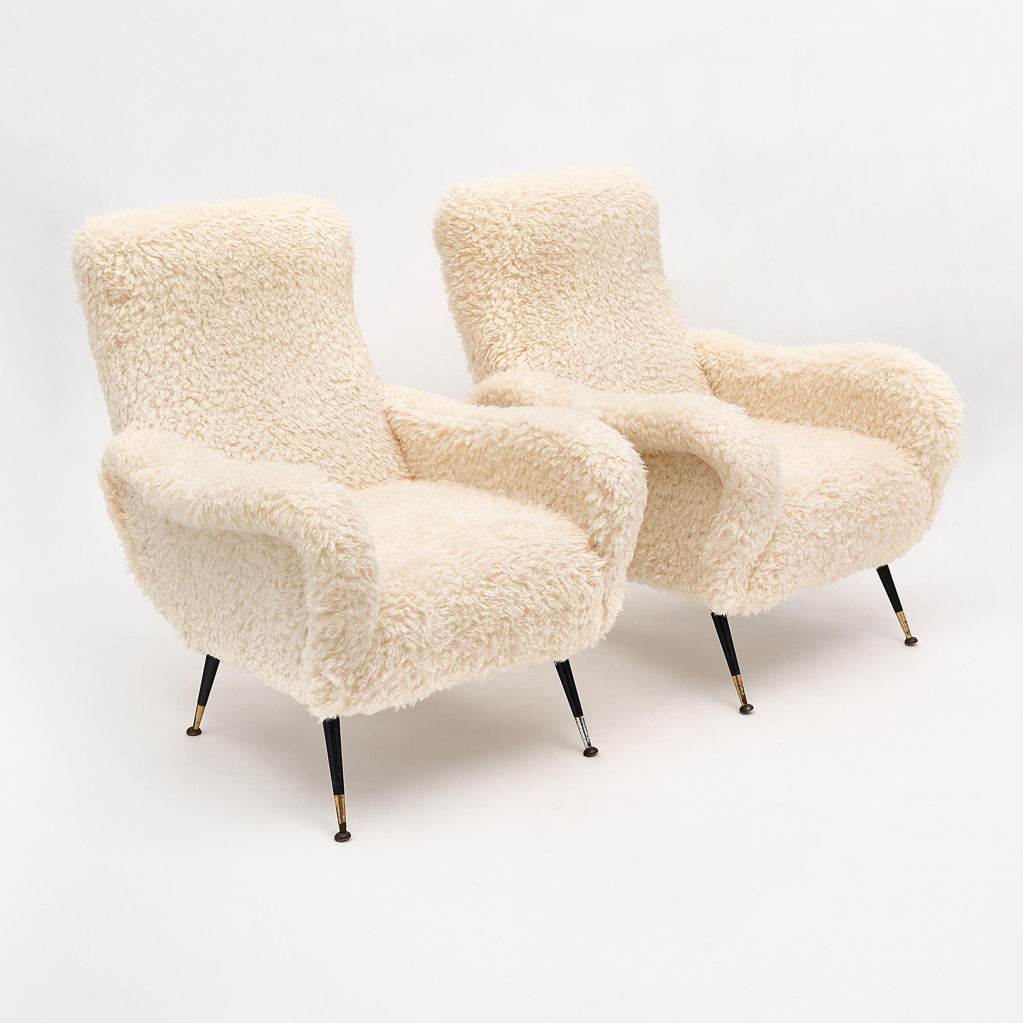 Italian vintage armchairs newly upholstered in a wool blend fur fabric. We love the iconic Italian lacquered steel and brass legs and warmth this pair brings to a space.