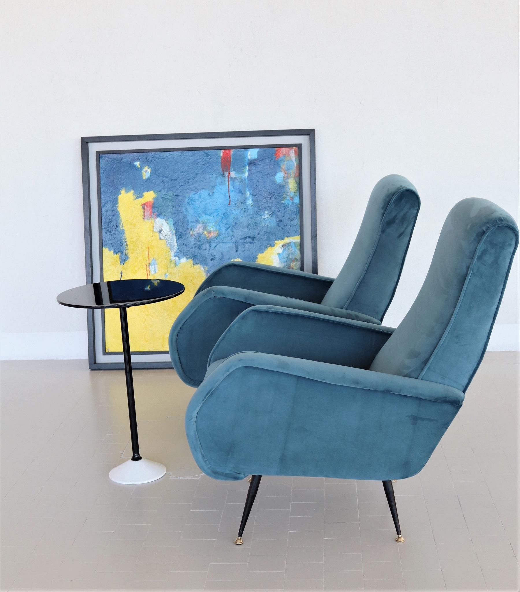 Magnificent and elegant pair of two Italian original midcentury armchairs or lounge chairs from the 1950s with brass stiletto feet.
Completely restored internally with quality material and outside reupholstered with soft Italian blue