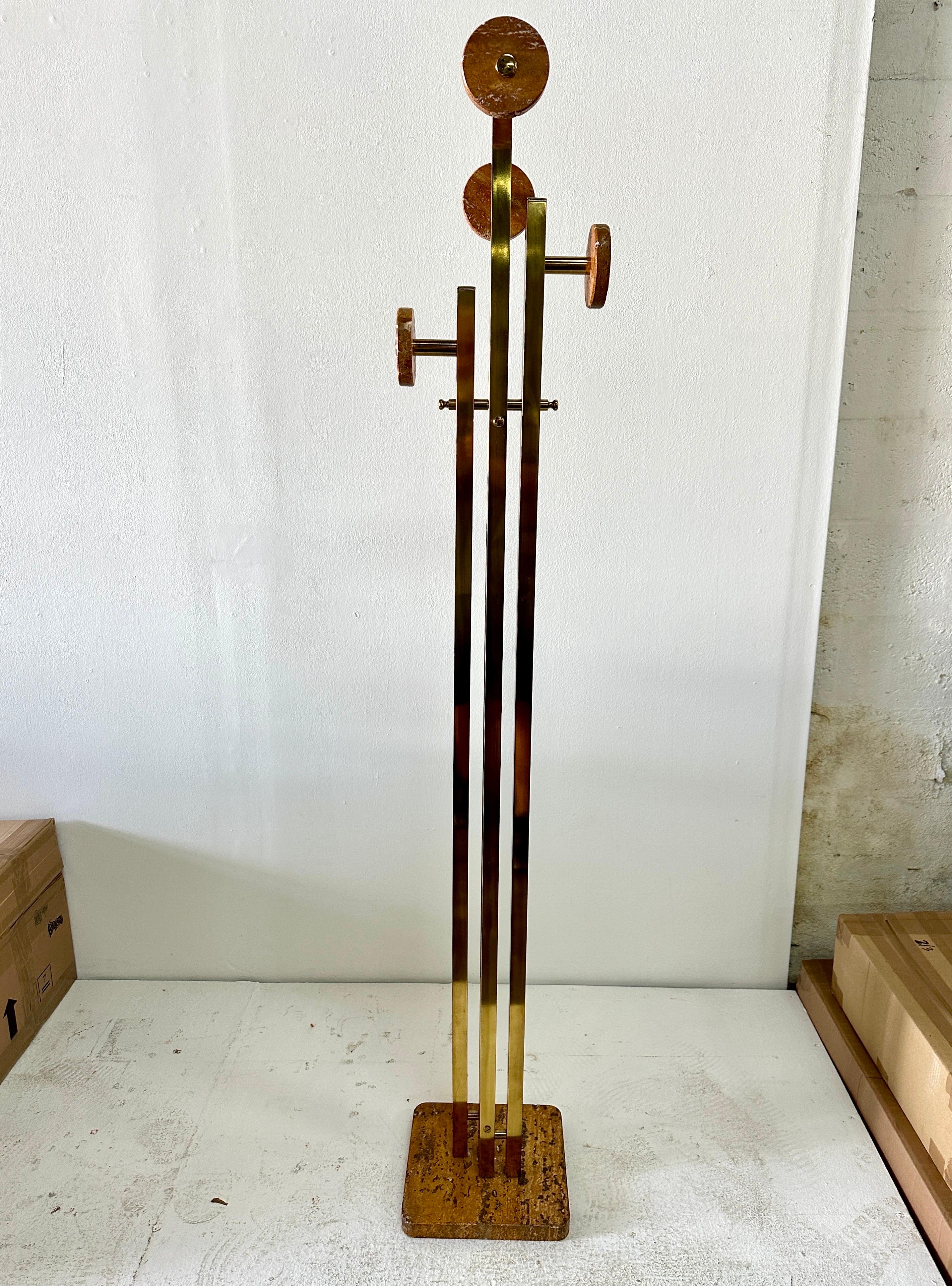 In amazing original condition, this spectacular coat stand features Giallo Siena Marble base and discs to hang your coats and hats in a very sculptural design. Brass frame and brass details. This piece alone is like art in your home.