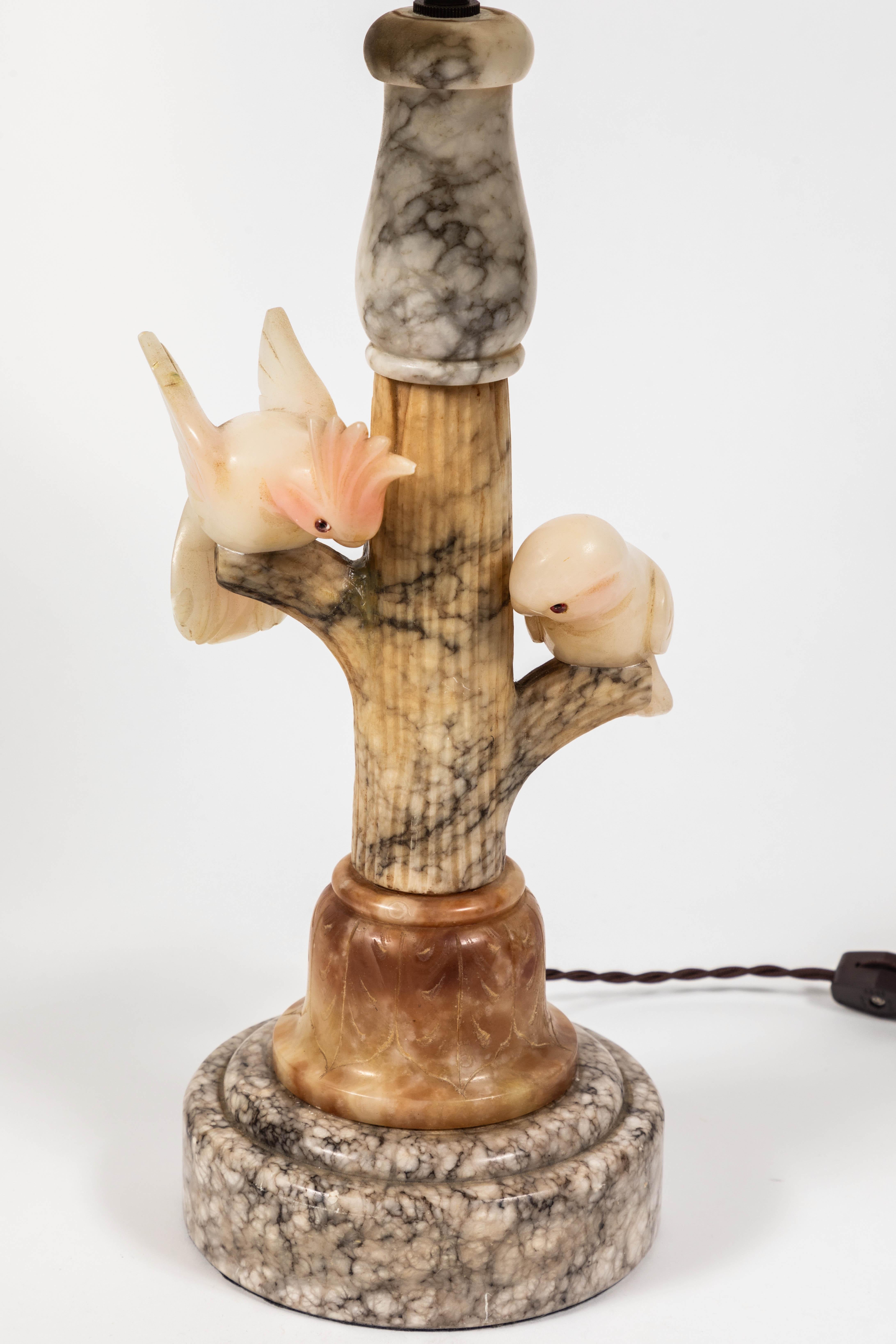 Italian vintage carved marble and alabaster lamp of tree with birds with custom linen shade.

circa 1930-1940s.

Repair was done on branch, as shown in photo.