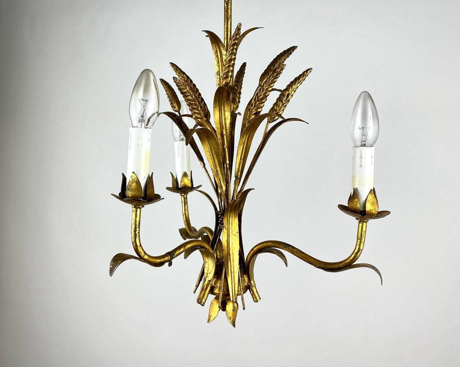 Gilded metal chandelier decorated with ears of wheat. 

Vintage. 

A Hollywood Regency “Coco Chanel“ style sheaf of wheat three-light gilt metal chandelier made in Italy, circa 1960-1970.

 Coco Chanel had used this sheaf of wheat type as a