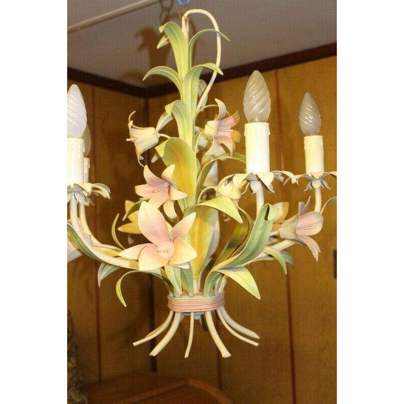 Medium sized Italian vintage flower chandelier, tole were lamp style with pink lily bouquet. It has 5 lights.

Condition: good

Note: Bulbs not included.
 