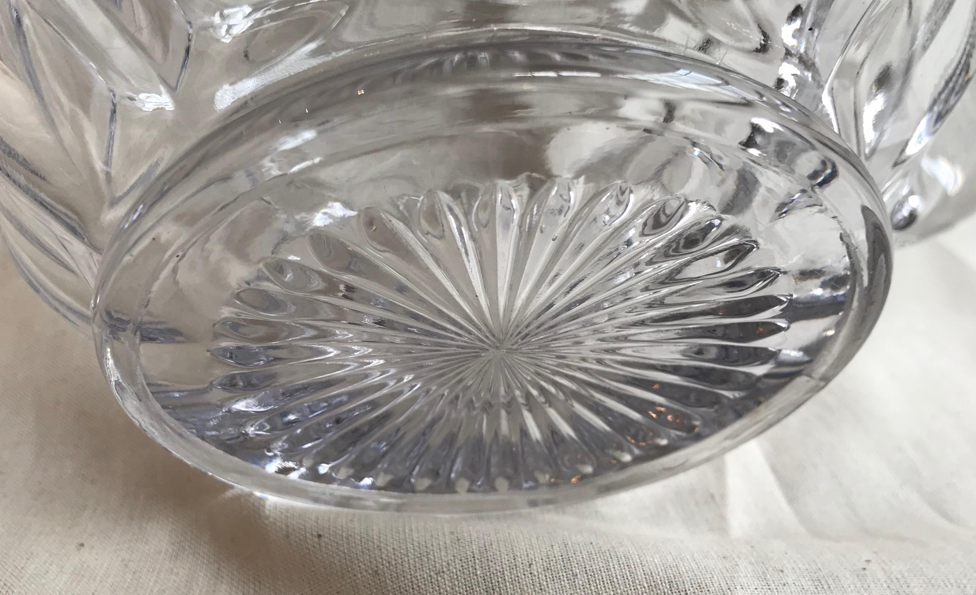 Italian glass water pitcher in very good condition. The wide melon shaped body make this pitcher perfect for serving drinks with ice such as lemonade or iced tea, circa 1950.