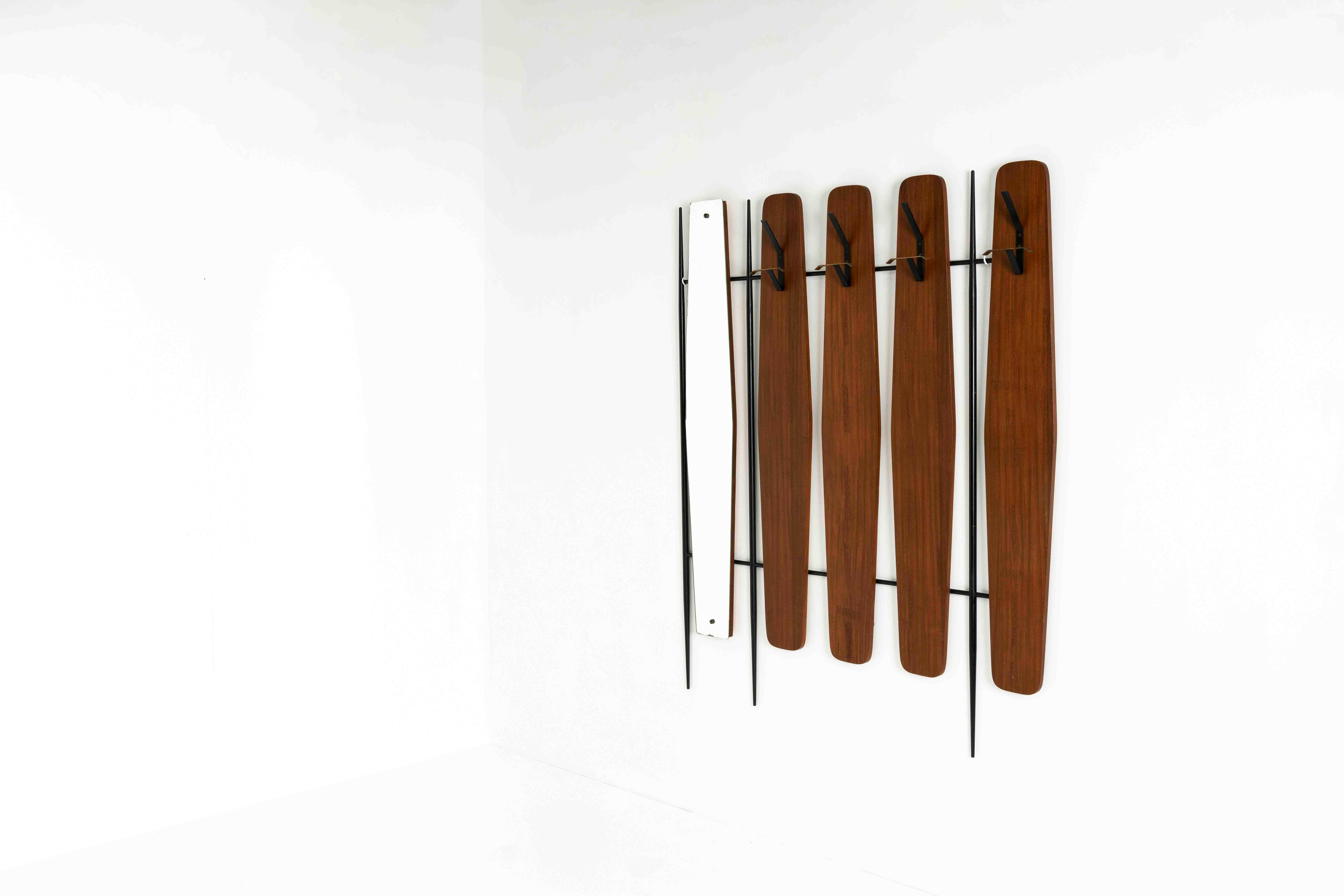 Italian Vintage Coat Rack with Mirror in the Style of Osvaldo Borsani from 1950s Italy. The coat rack features a mirror and multiple copper hooks for coats and hats. This coat rack can be mounted to the wall and has a base of black-coloured steel.