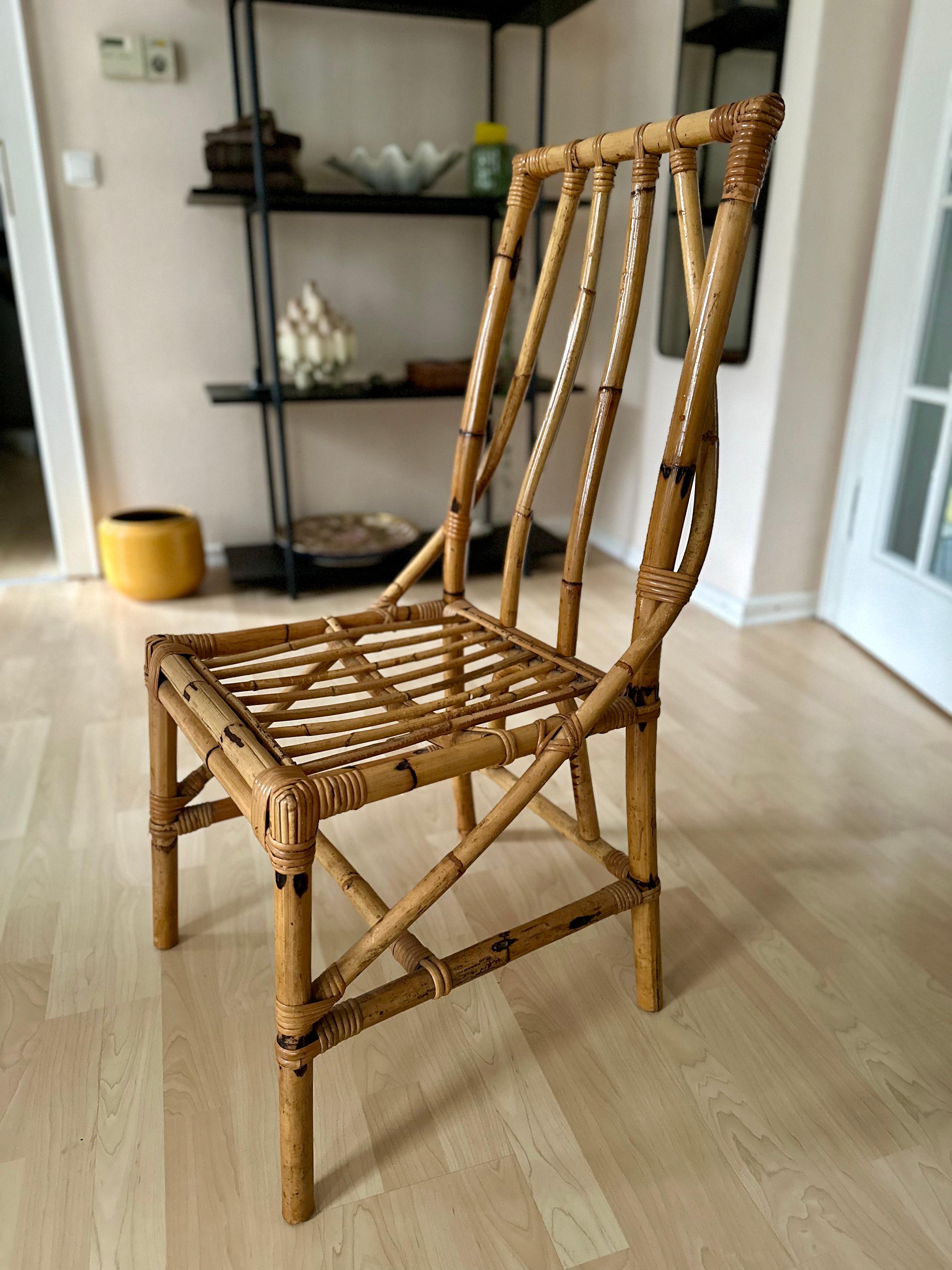 Indulge in the allure of mid-century Italian design with our finely crafted Rattan Chair from the 1950s. This masterpiece boasts an organic form that catches the eye, highlighted by two graceful struts extending from the backrest to the front legs.