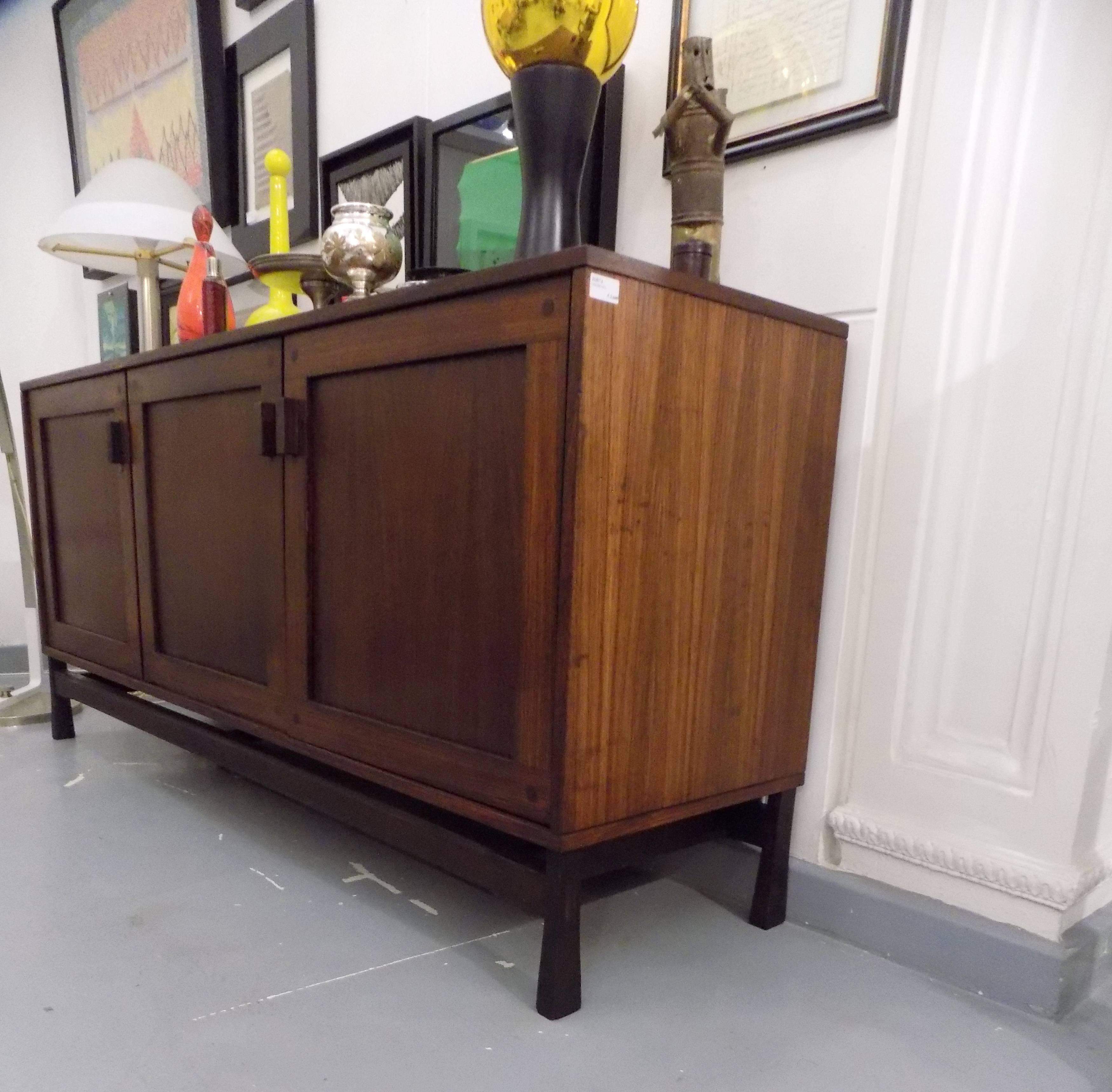 A stunning three-door credenza or sideboard with internal drawer unit with 3 pull-out service drawers.