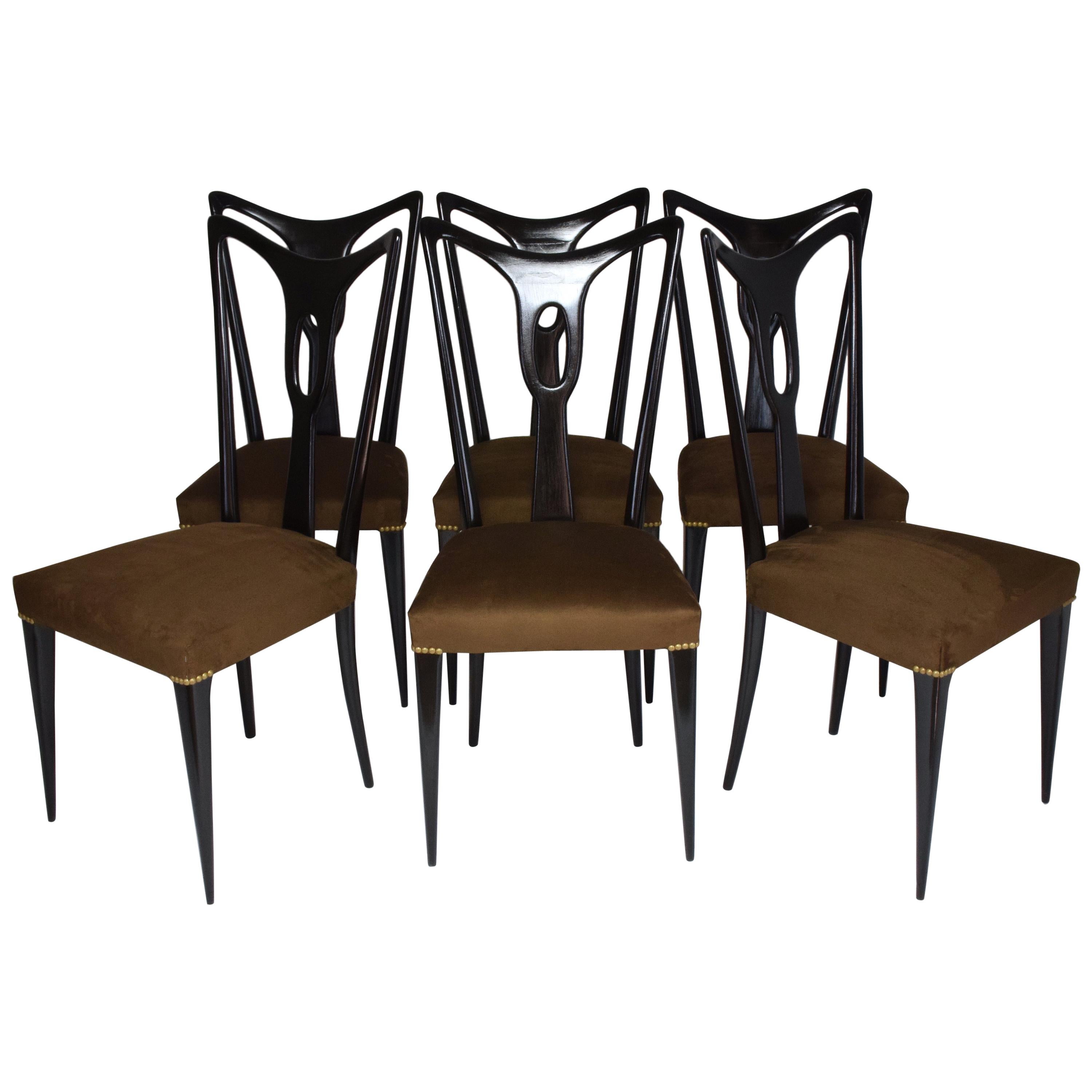 Set of six 20th century vintage dining chairs designed by Guglielmo Ulrich circa 1940s in fully restored condition composed of ebonized wood and re-upholstered with new brass nailhead trim and in a brown fabric.
Italy, circa 1950s.
 ----
All our