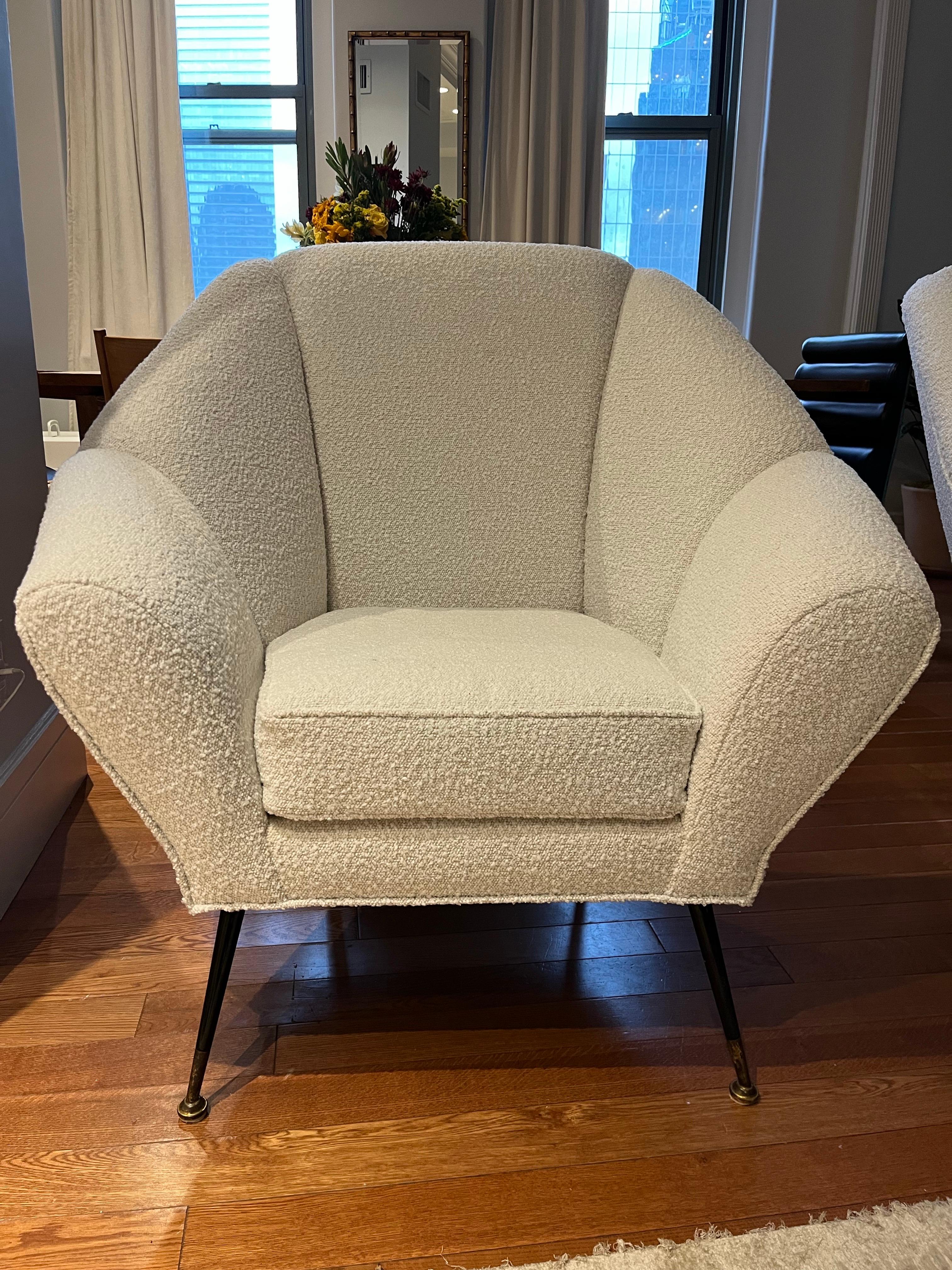 Incredible pair of Italian Vintage White Boucle Wool Chairs. Metal and brass legs and a beautiful shape. These chairs are heavy and comfortable. Lovely and ready for pick up.