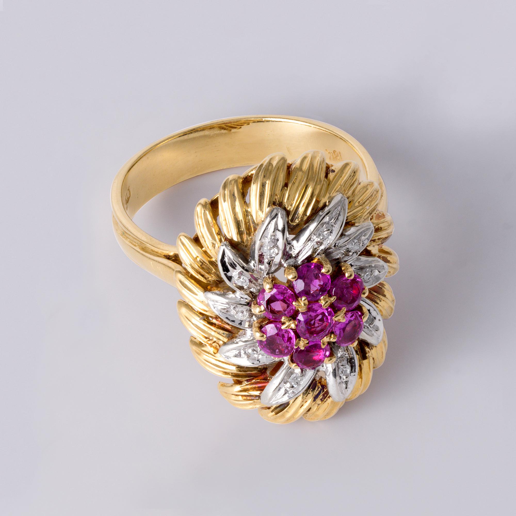 This exquisite vintage Italian ring is a captivating celebration of color, craftsmanship, and character. Designed in a bold and exotic floral motif, it features vibrant natural gemstones set in rich, layered two-tone 18K gold—a true testament to the