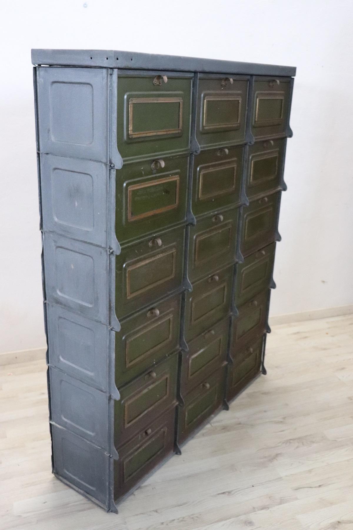 Italian industrial multi drawers metal apothecary cabinet, 1940s. Equipped with sixteen comfortable drawers. Condition used.