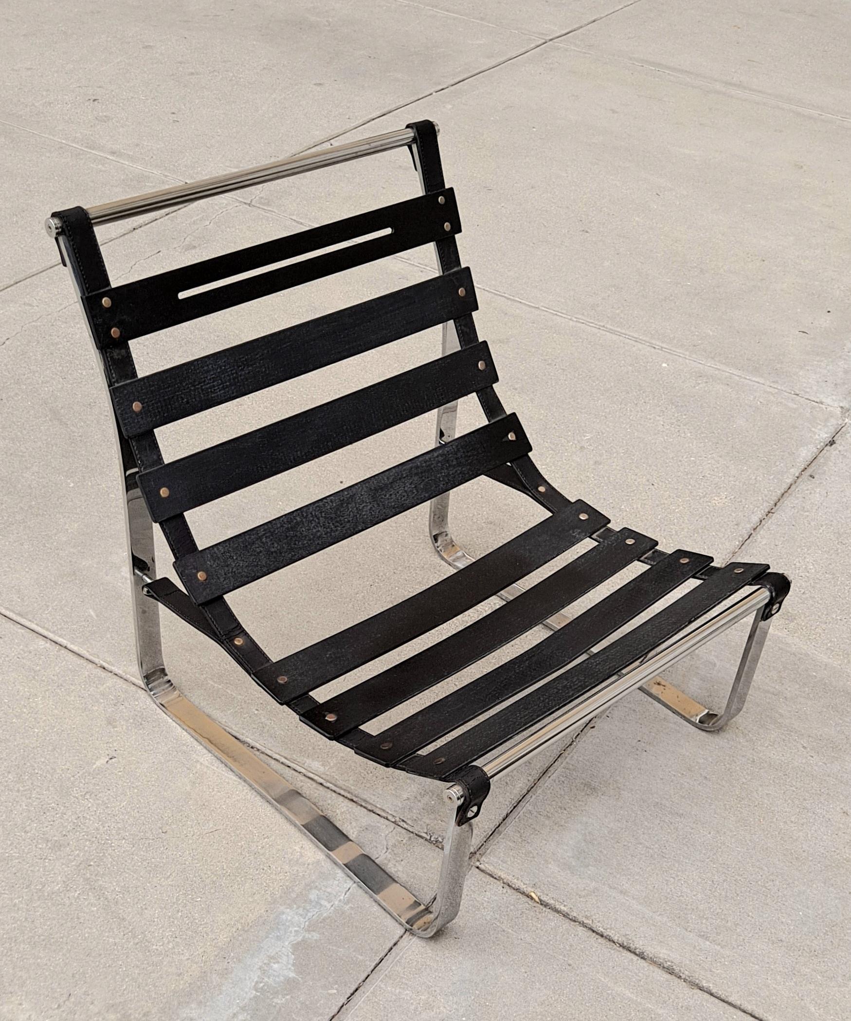 Italian vintage lounge chair design by Ico Parisi produced for MIM Roma during 1960s. The chair has stainless steel and chrome frame with stitched leather supports and seat with black painted wooden slats. The seating and backrest have brand new