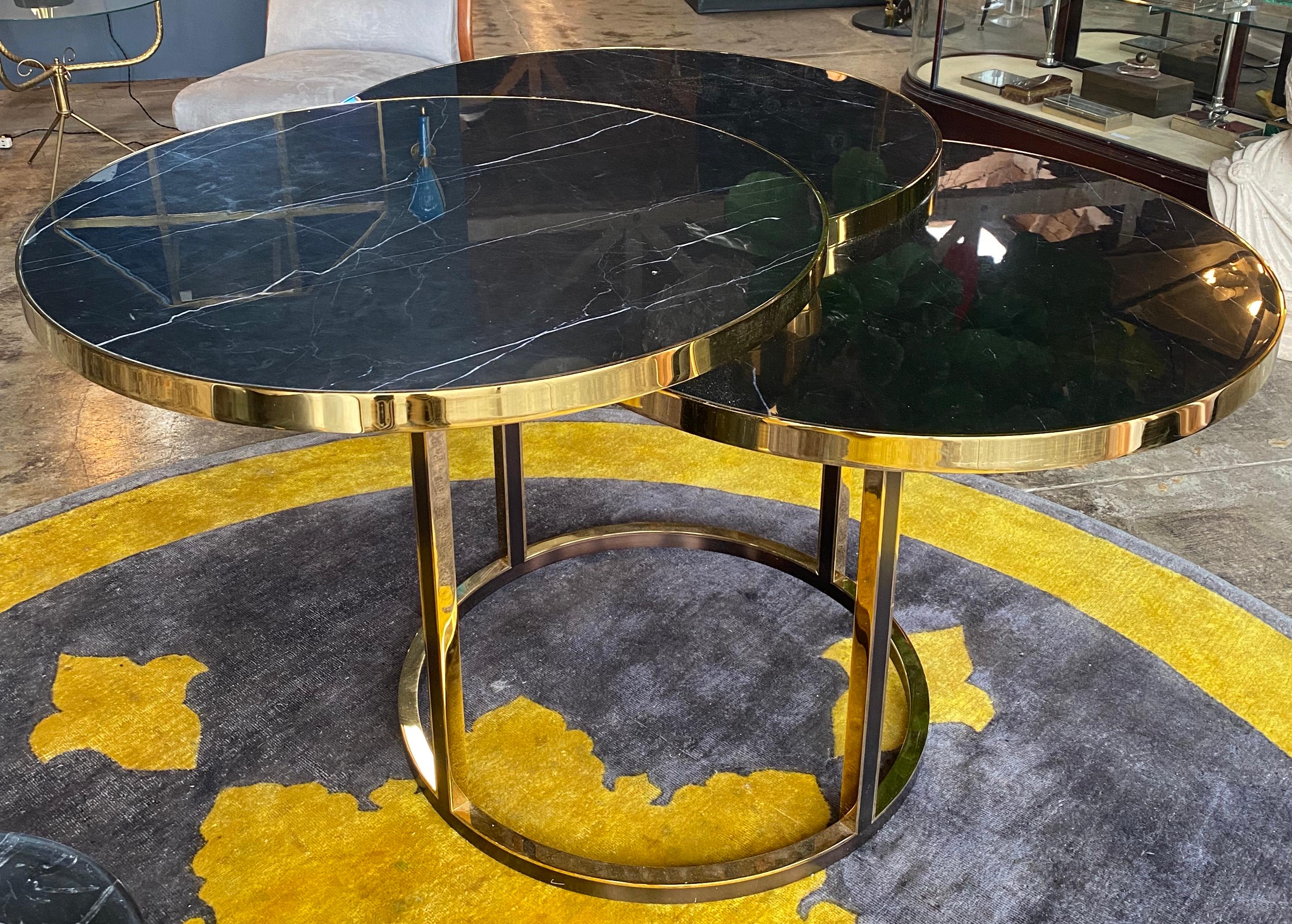 Beautiful Italian side/coffee table made with brass base and black marble, beautiful shape made with 3 circular marble top.
Nothing touches, nothing clashes, which gives this piece of furniture a completely peaceful yet strong expression. A piece
