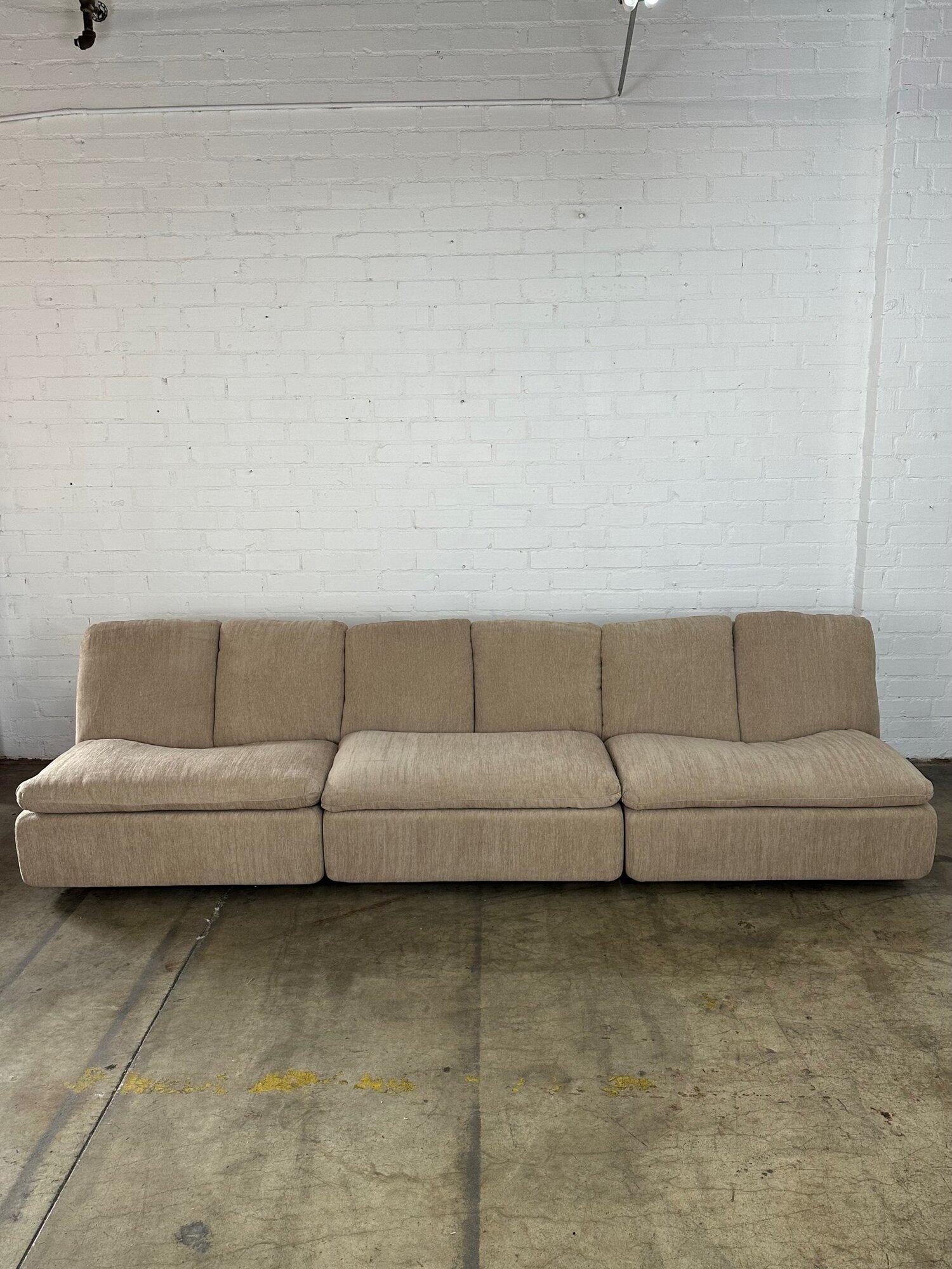 W200 D36 H30.5

Single W40.5 D34 H30.5 SW39 SD22 SH15 AH21

Vintage modular low profile sofa sections. Sofa has a strong and sturdy frame with fresh fabric. Each section sits on solid wooden pine legs that are pretty hidden. Each section has