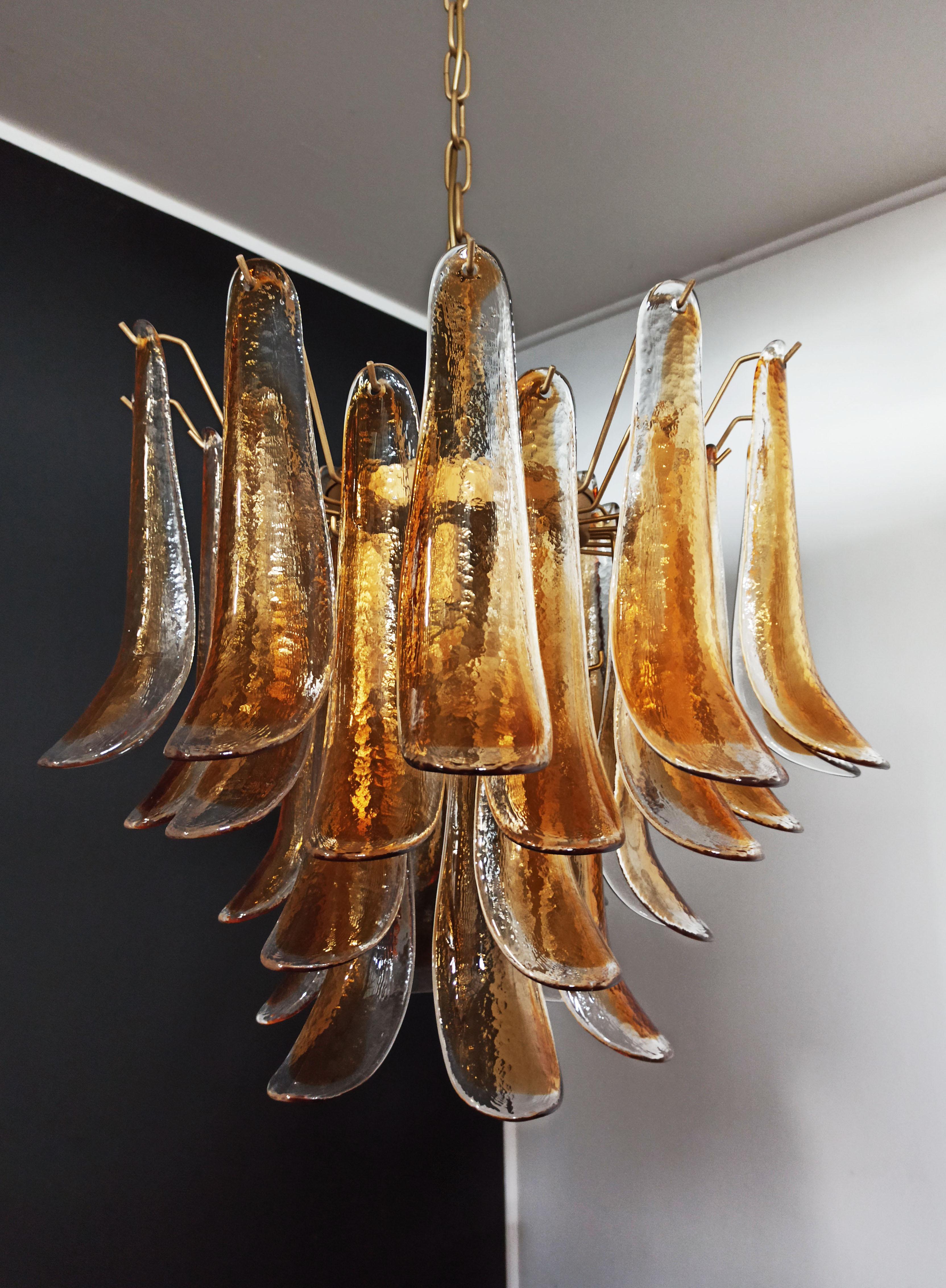 Fantastic chandelier with 36 transparent with an amber spot inside glasses, gold painted structure. The glasses are very high quality, the photos do not do the beauty, luster of these glasses.
Period: late XX century
Dimensions: 47.25 inches (120