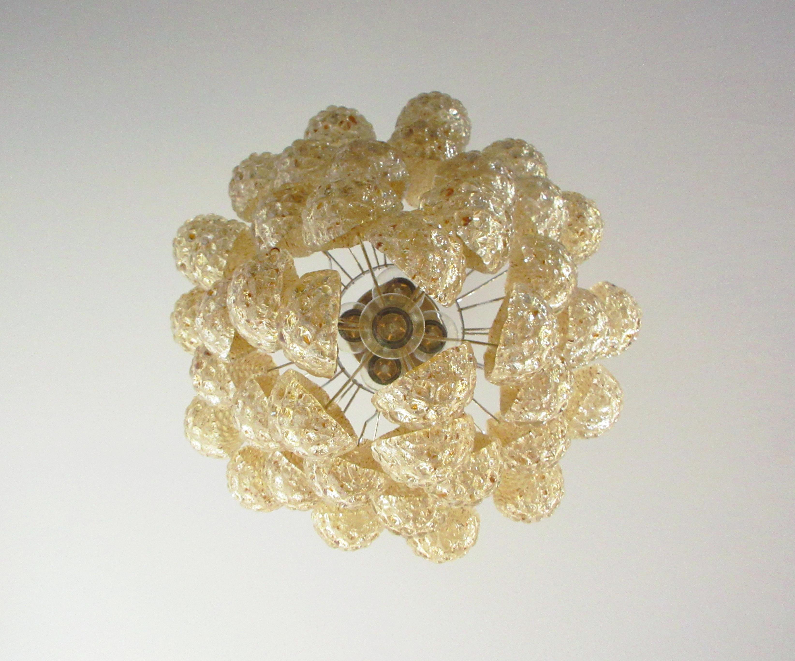 Italian vintage Murano chandelier made by 41 glass petals (amber crystal, smooth outside, with crystal trasparent and amber powder and then rough inside.) in a chrome frame.
Period: late XX century
Dimensions: 49,20 inches (125 cm) height with