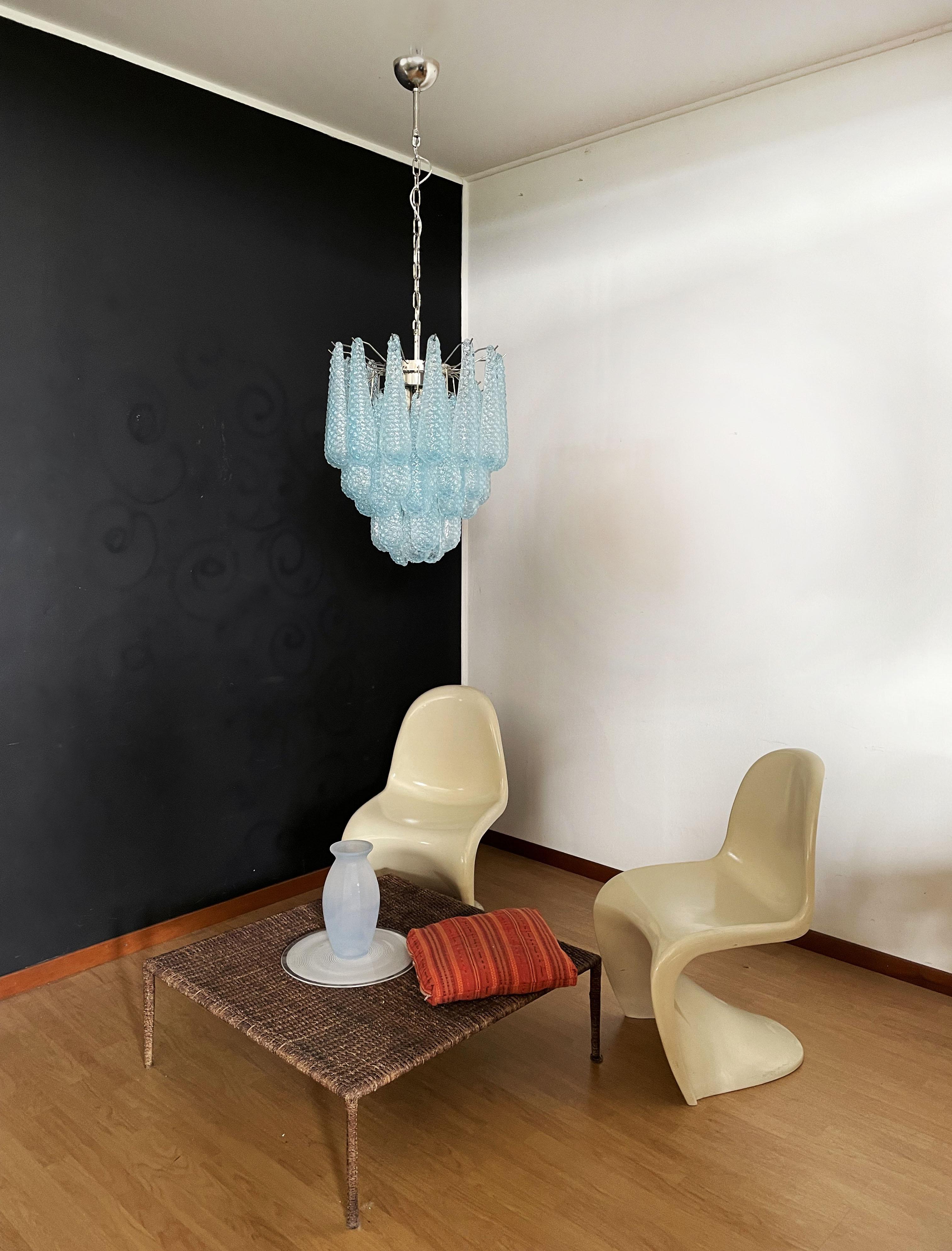 Italian vintage Murano chandelier made by 41 glass petals (light blue crystal, smooth outside, with powder and then rough inside.) in a chrome frame.
Period: late 20th century
Dimensions: 49,20 inches (125 cm) height with chain; 25,80 inches (68