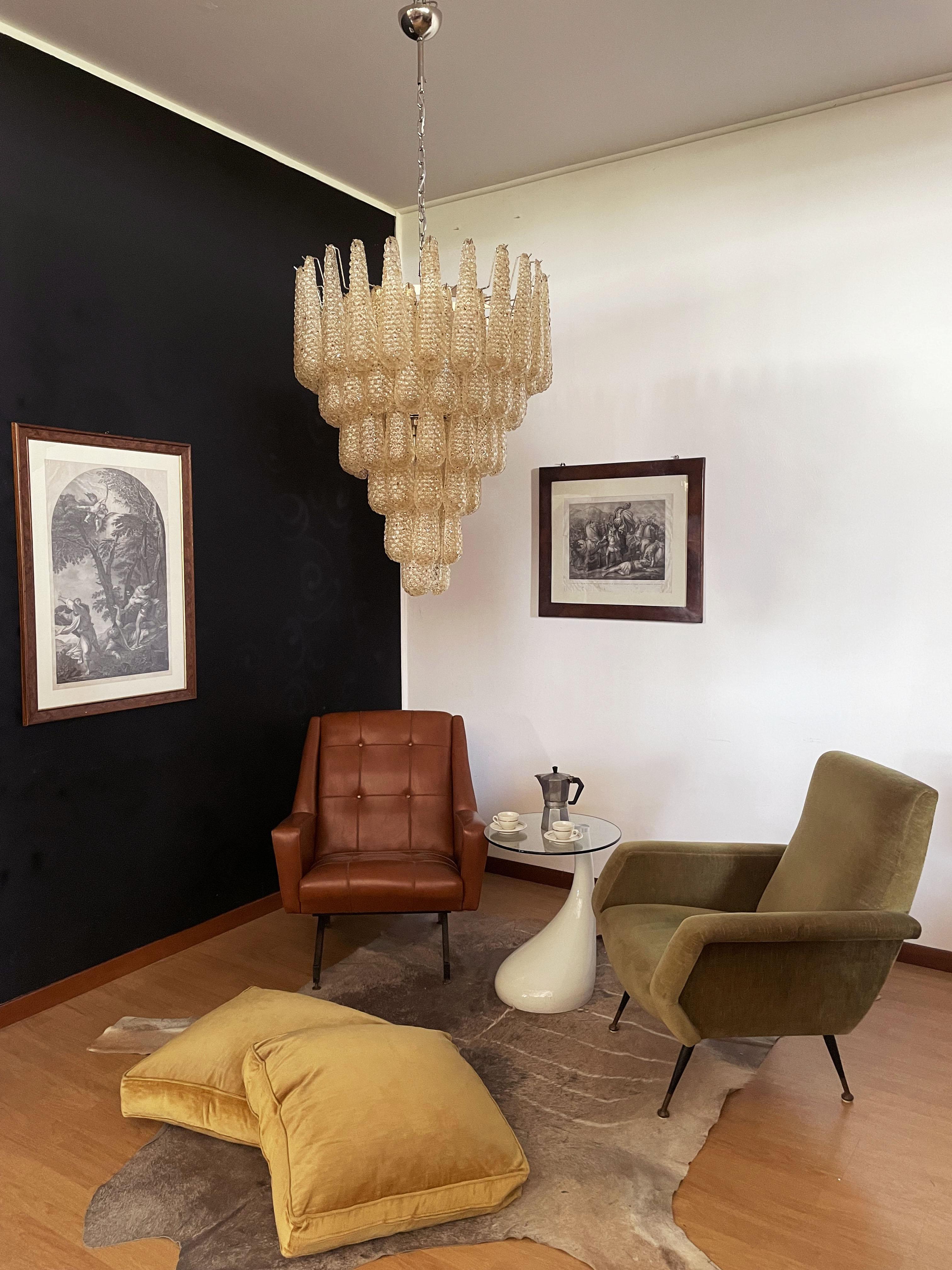 Huge Italian vintage Murano chandelier made by 75 glass petals (amber crystal, smooth outside, with crystal powder and then rough inside.) in a nichel metal frame.
Period: Late XX century
Dimensions: 65 inches (165 cm) height with chain; 37,40