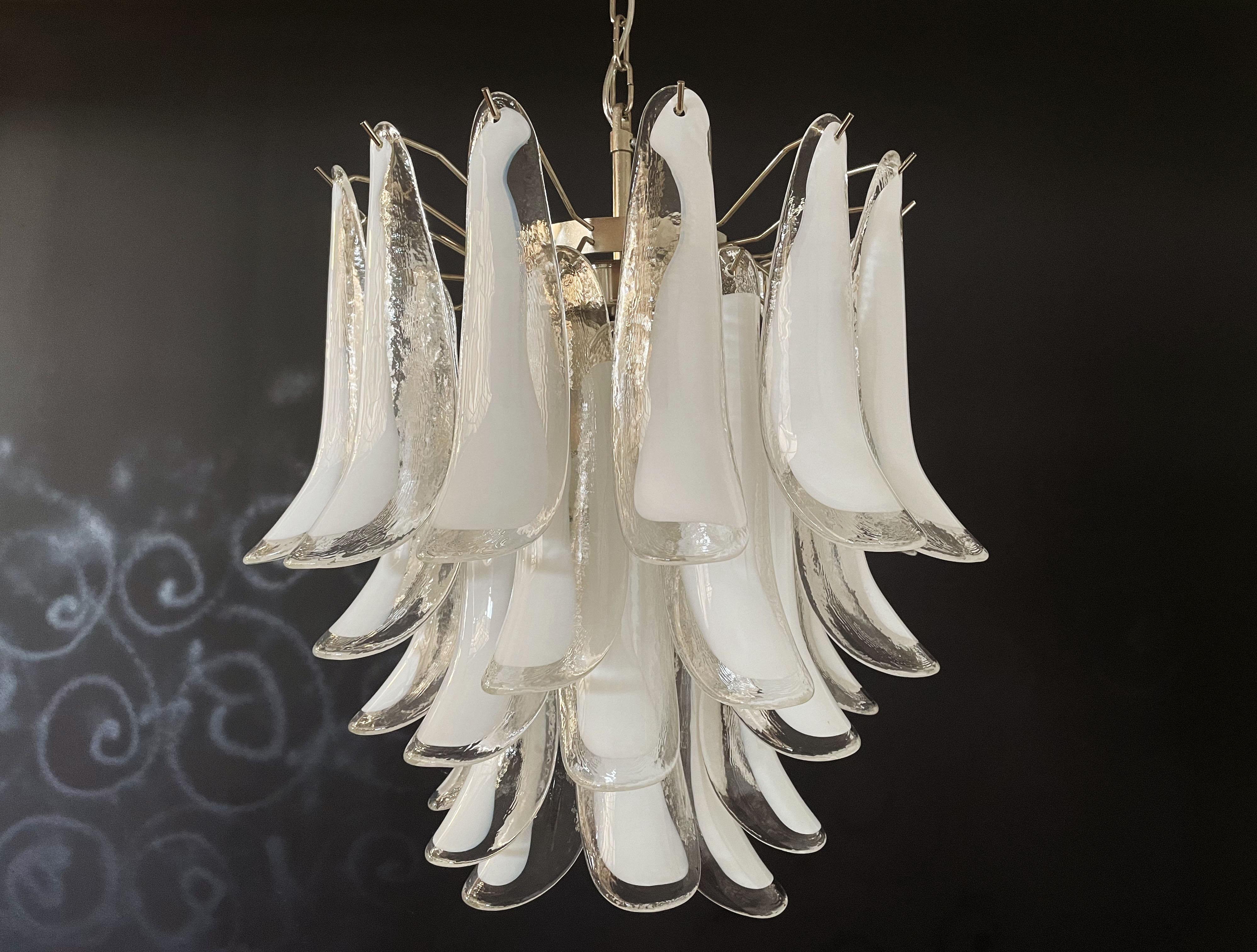 Huge Italian vintage Murano chandelier made by 41 glass petals (transparent and white “lattimo”) in a chrome frame.
Period: 1760's / 180's
Dimensions: 46 inches (117 cm) height with chain; 25,60 inches (65 cm) height without chain; 22,85 inches