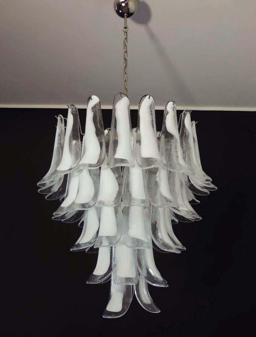 Huge Italian vintage Murano chandelier made by 52 glass petals (transparent and white “lattimo”) in a chrome frame.
Period: late XX century
Dimensions: 55, 10 inches (140 cm) height with chain; 29, 50 inches (75 cm) height without chain; 26 inches