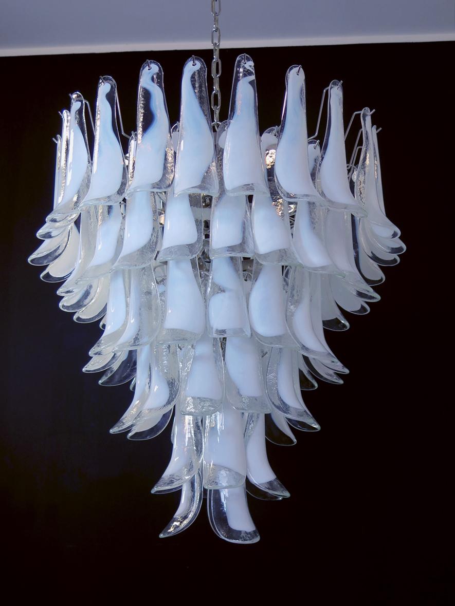Huge Italian vintage Murano chandelier made by 75 glass petals (transparent and white “lattimo”) in a chrome frame.
Period: late XX century
Dimensions: 65 inches (165 cm) height with chain; 37,40 inches (95 cm) height without chain; 31,50 inches