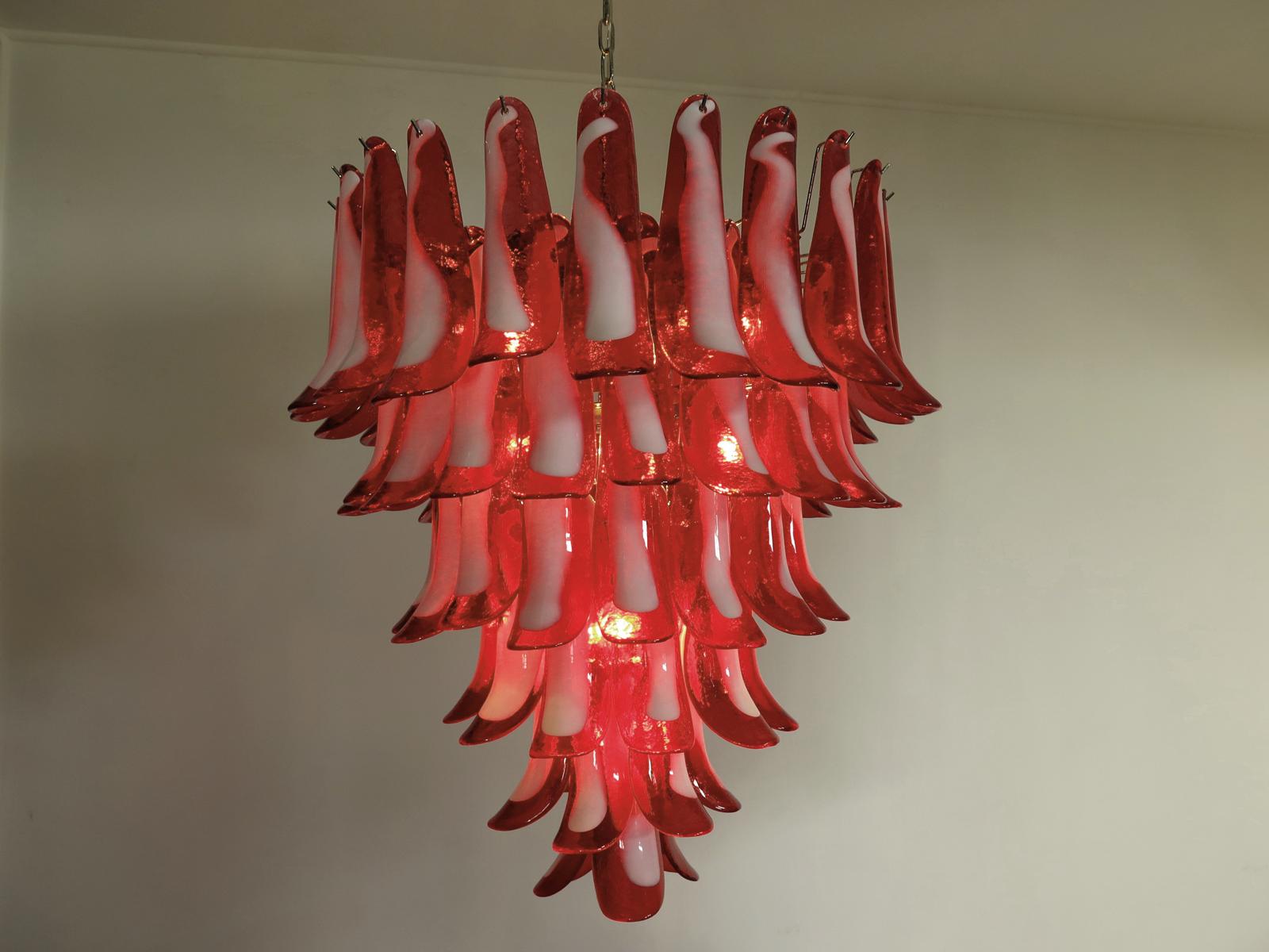 Huge Italian vintage Murano chandelier made by 75 glass petals (red and white “lattimo”) in a chrome frame.
Period: late XX century
Dimensions: 65 inches (165 cm) height with chain; 37,40 inches (95 cm) height without chain; 31,50 inches (80 cm)