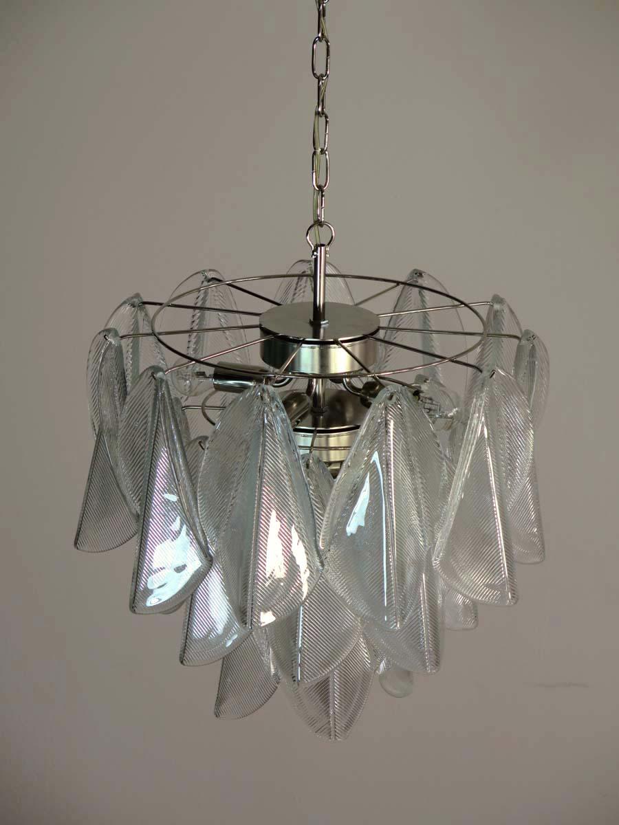 Rare Italian vintage Murano chandelier. The fixture is made up of 23 individual handblown trasparent glass elements hanging from a chrome frame.
Period: 1970s
Dimensions: 46,45 inches (118 cm) height with chain; 23,60 inches (60 cm) height without