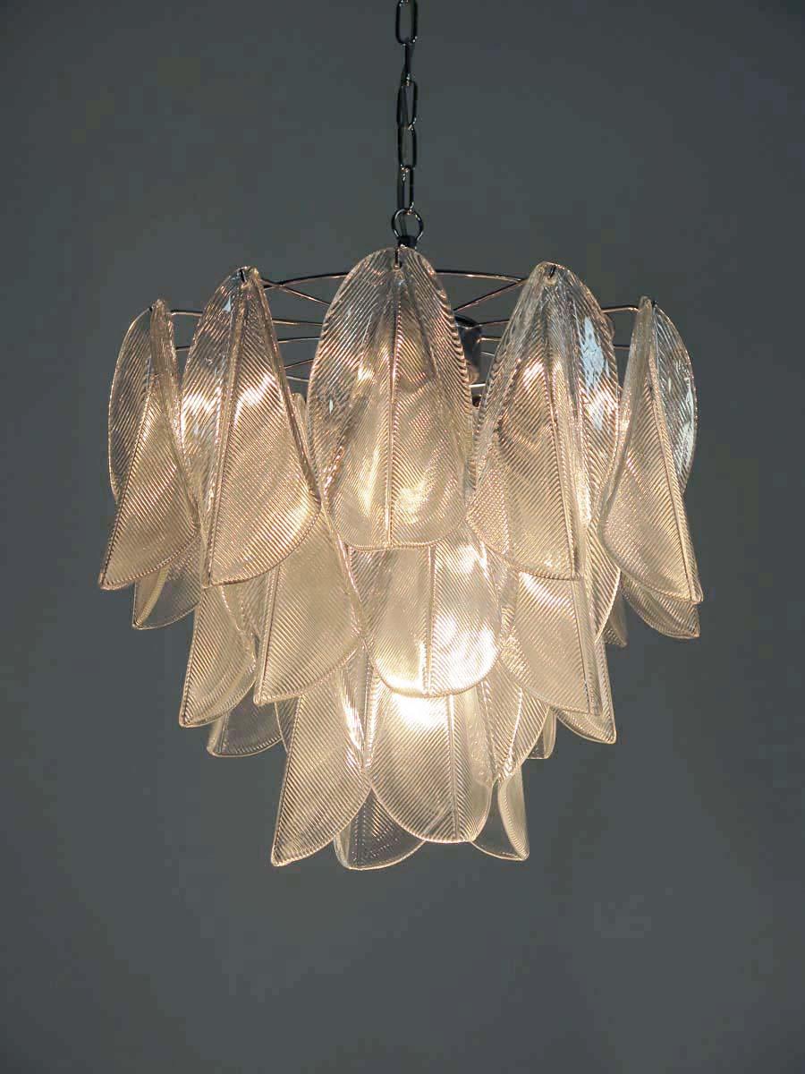 Rare Italian vintage Murano chandelier. The fixture is made up of 23 individual handblown trasparent glass elements hanging from a chrome frame.
Period: late XX century
Dimensions:	46,45 inches (118 cm) height with chain; 23,60 inches (60 cm) height