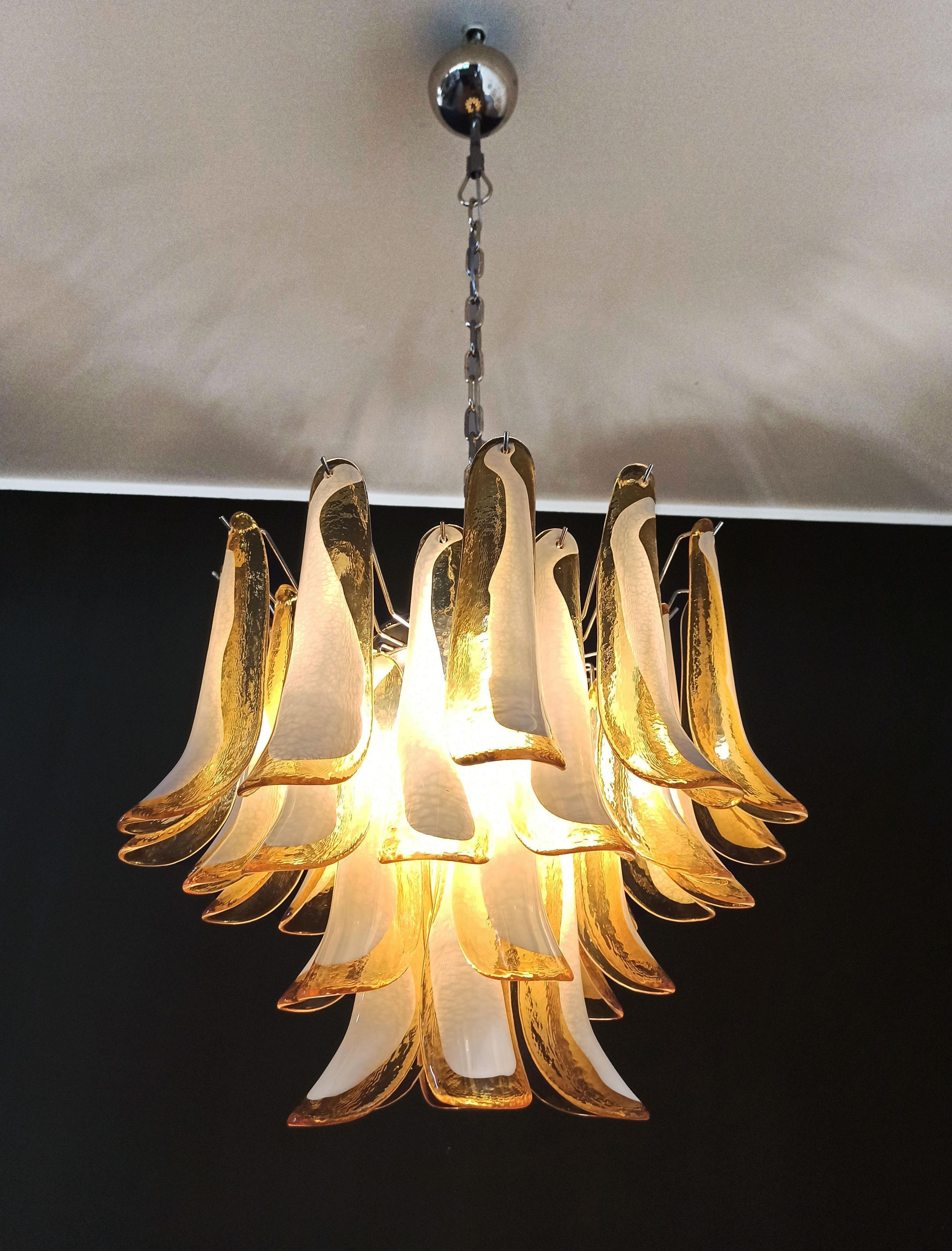 1970’s Murano Italian glass chandelier. Fantastic chandelier with amber and white “lattimo” glasses, nickel-plated metal frame. It has 36 big monumental petals glass. The glasses are very high quality, the photos do not do the beauty, luster of
