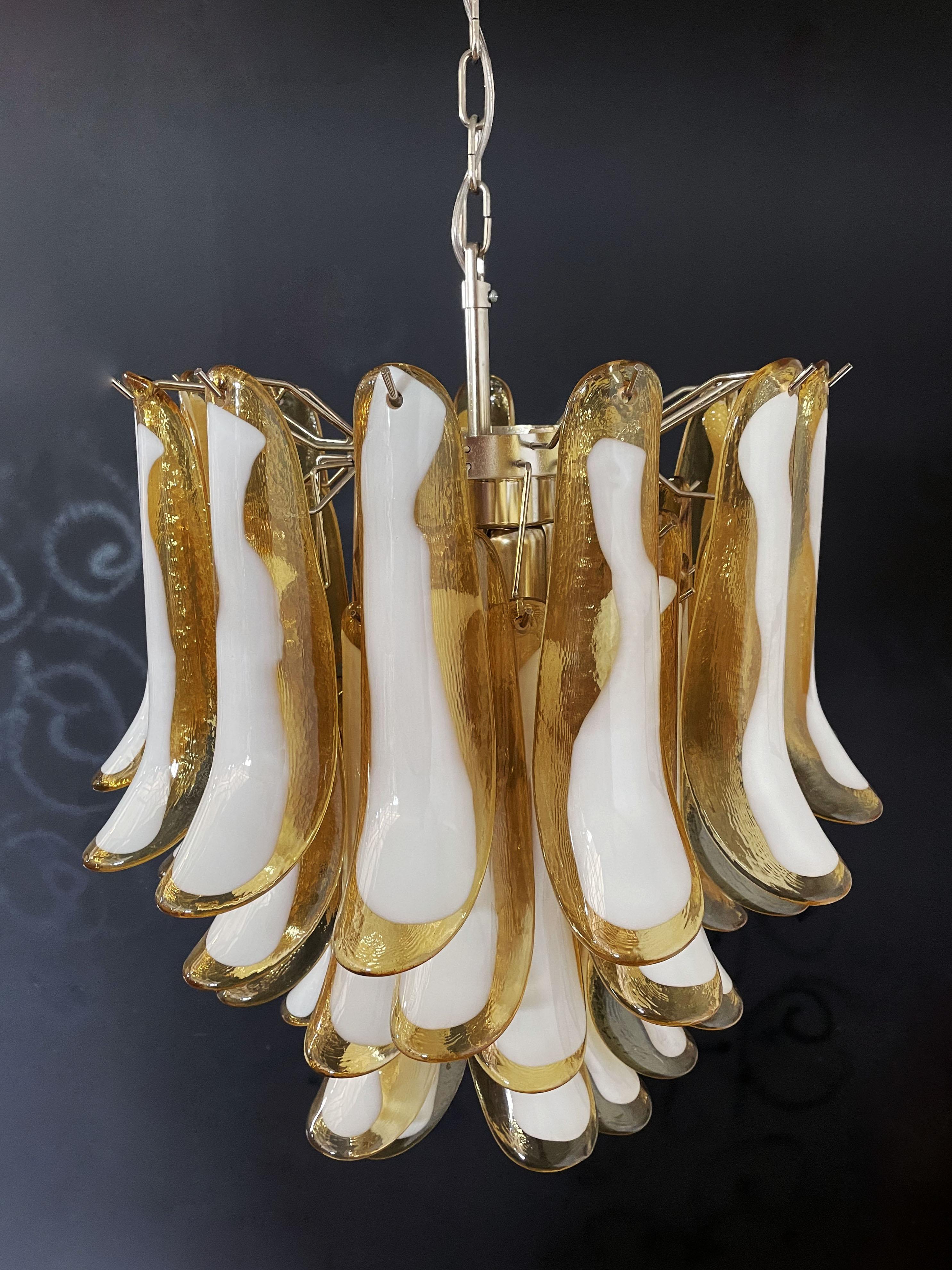 1970’s Murano Italian glass chandelier. Fantastic chandelier with caramel and white “lattimo” glasses, nickel-plated metal frame. It has 41 big monumental petals glass. The glasses are very high quality, the photos do not do the beauty, luster of