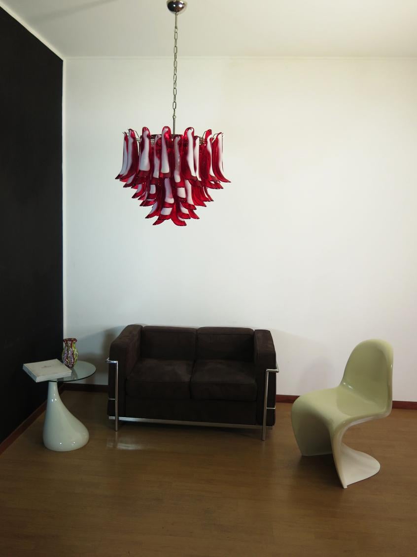 Murano Italian glass chandelier. Fantastic chandelier with red and white “lattimo” glasses, nickel-plated metal frame. It has 53 big monumental petals glass. The glasses are very high quality, the photos do not do the beauty, luster of these