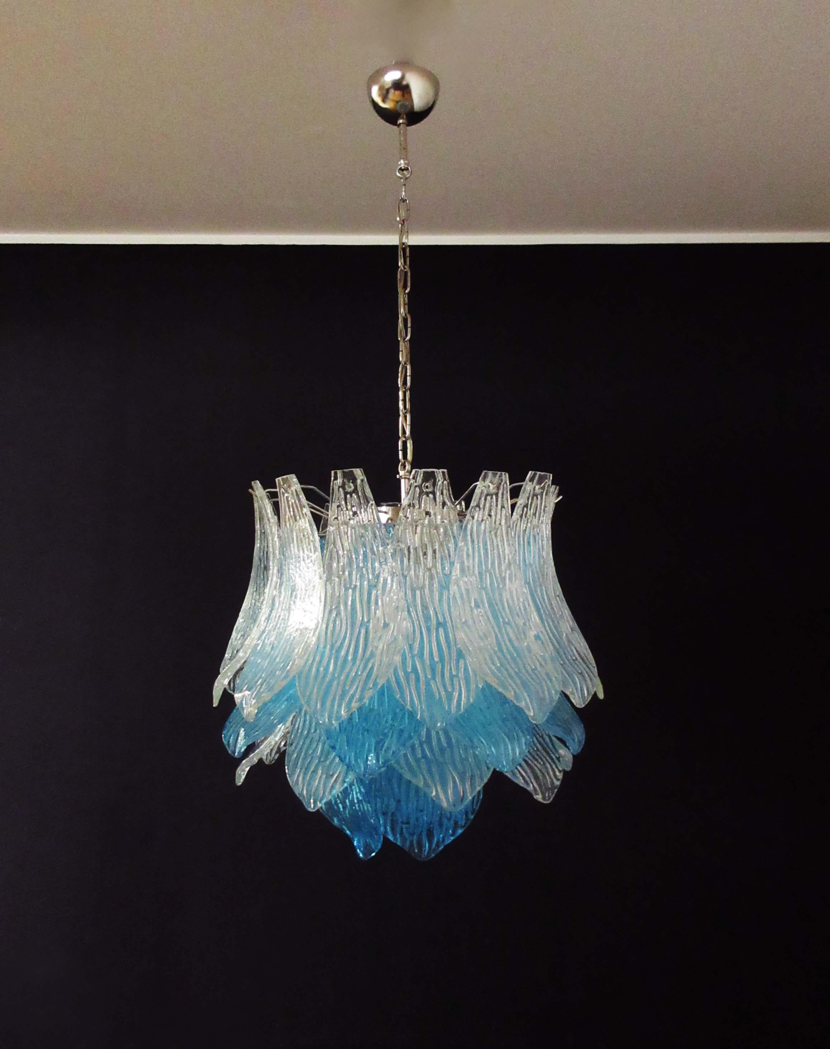 Beautiful and huge Italian Murano Chandelier composed of 38 splendid trasparent and blue glasses that give a very elegant look. The glasses of this chandelier are real works of art. This chandelier is shaped like a blossoming flower.
Period: