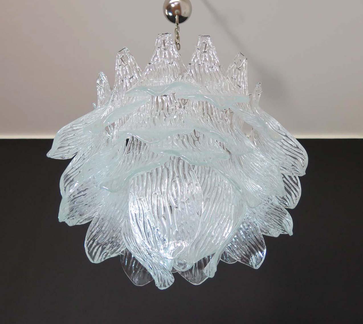 Beautiful and huge Italian Murano chandelier composed of 38 splendid trasparent glasses that give a very elegant look. The glasses of this chandelier are real works of art. This chandelier is shaped like a blossoming flower.
Period: